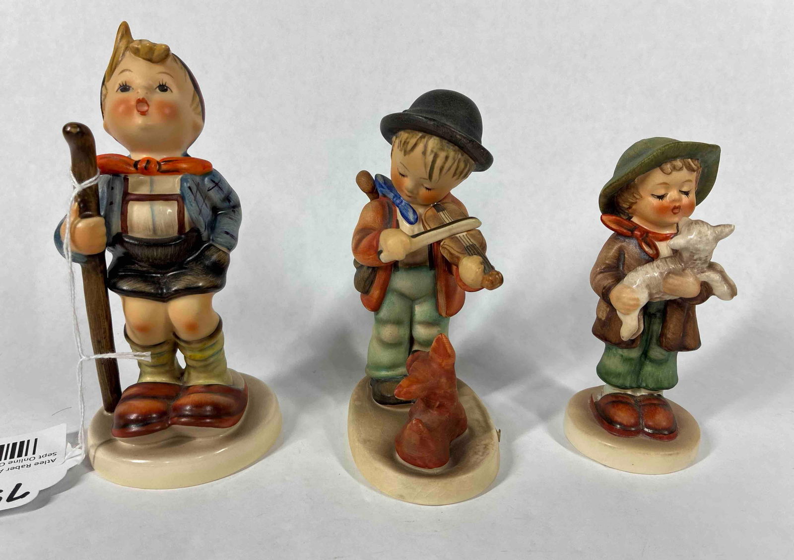 Goebel Hummels: Little Hiker, Puppy love, and Lost sheep. All are approx 5 to 6 inches tall