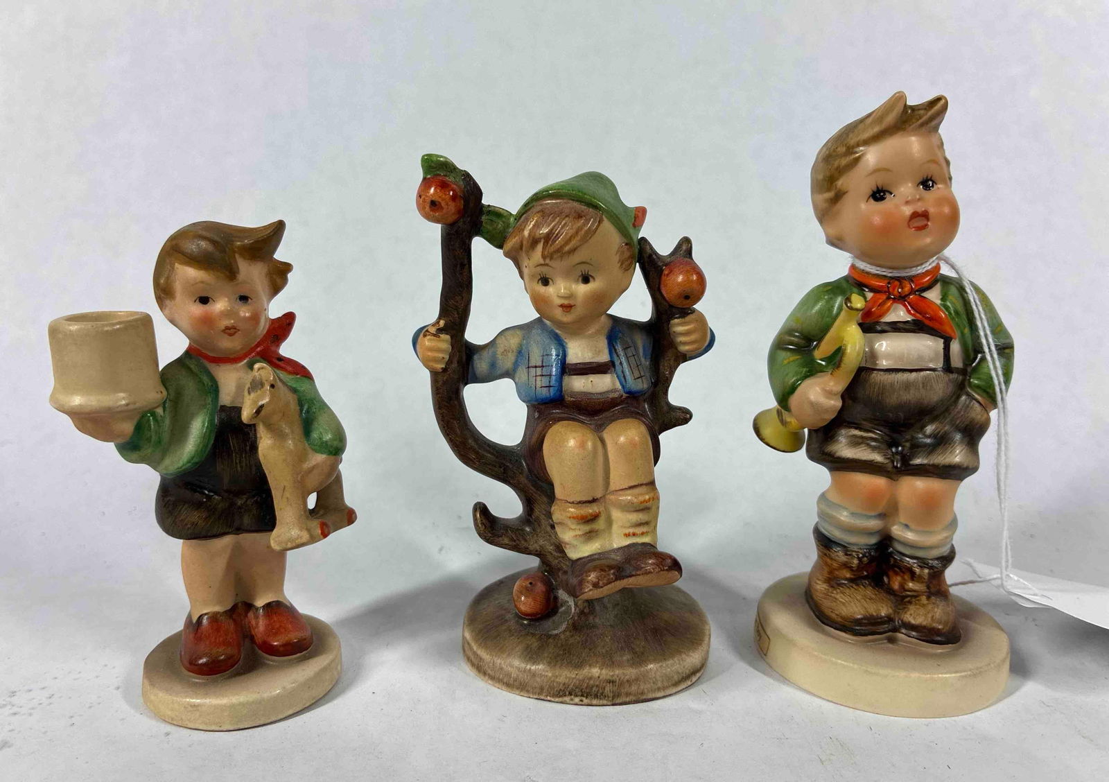 Goebel Hummel Figurine Lot of 3: Lot includes 3 Boy figurines with no chips cracks or breaks 3.5 to 4 in. Tall