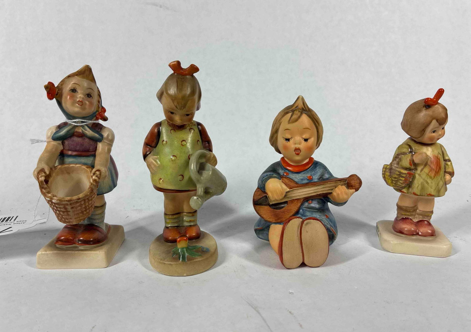 Goebel Hummel Figurine Lot of 4: Lot includes 4 girl figurines with no chips cracks or breaks? 3.5 to 4 in. Tall?