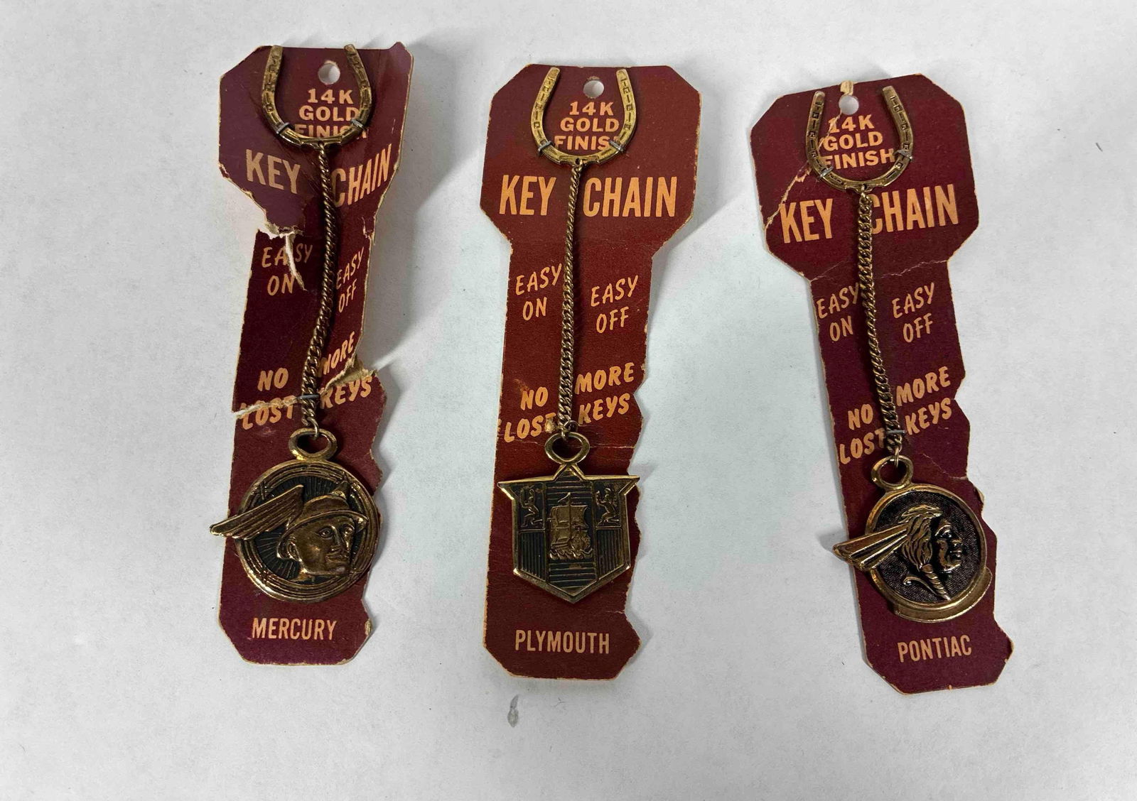 Mercury, Pontiac, and Plymouth Keychains: No more lost keys edition. 14k gold finish