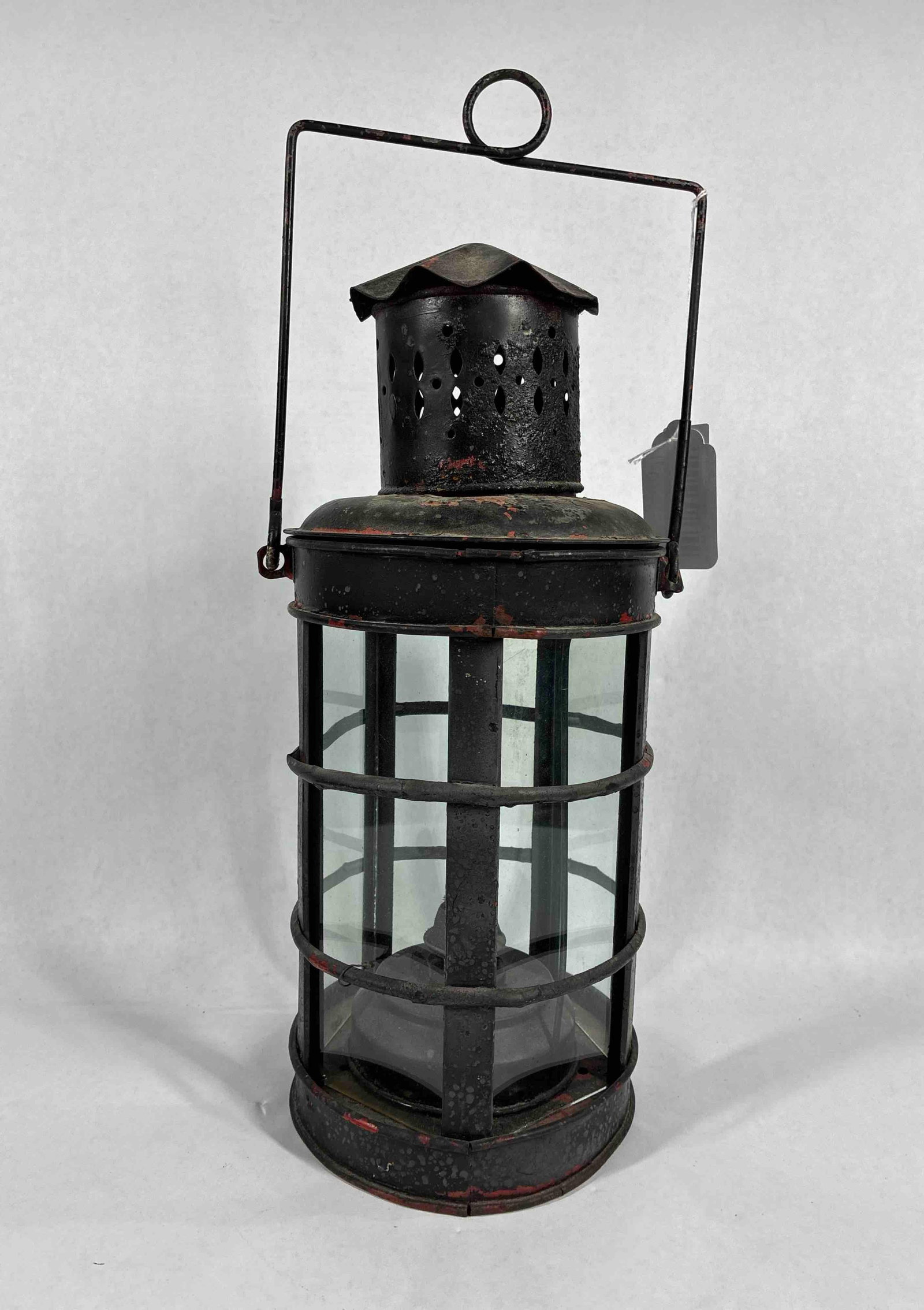 Navigation Sea Lantern: Early metal body with smoke shade , handle, and glass panels. Wick looks complete. No markings. 15.5 inches tall