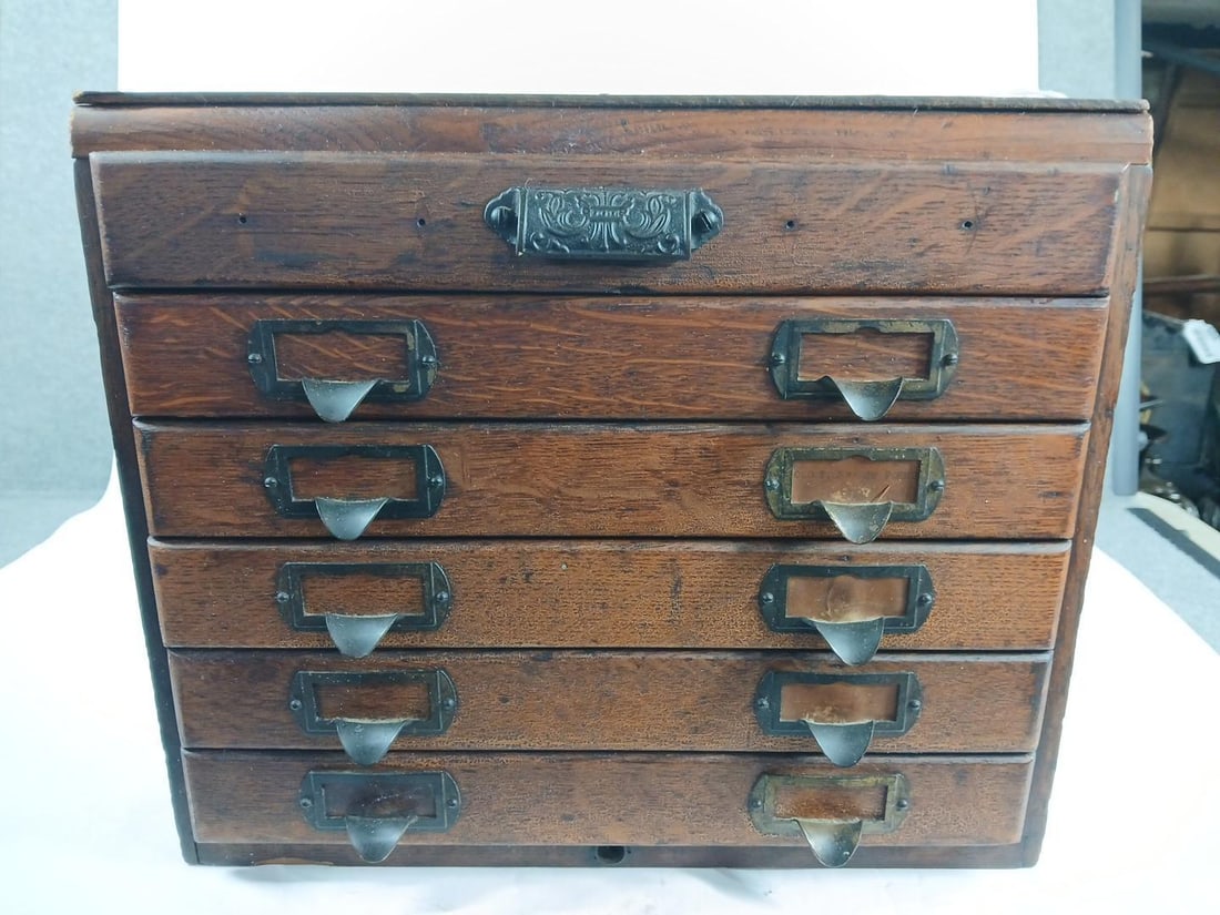 6 Drawer Hardware/Spool Cabinet: Oak cabinet with early hardware. Each drawer is 1 inch deep. Top and back have been repaired with new wood. 16x19x13.5