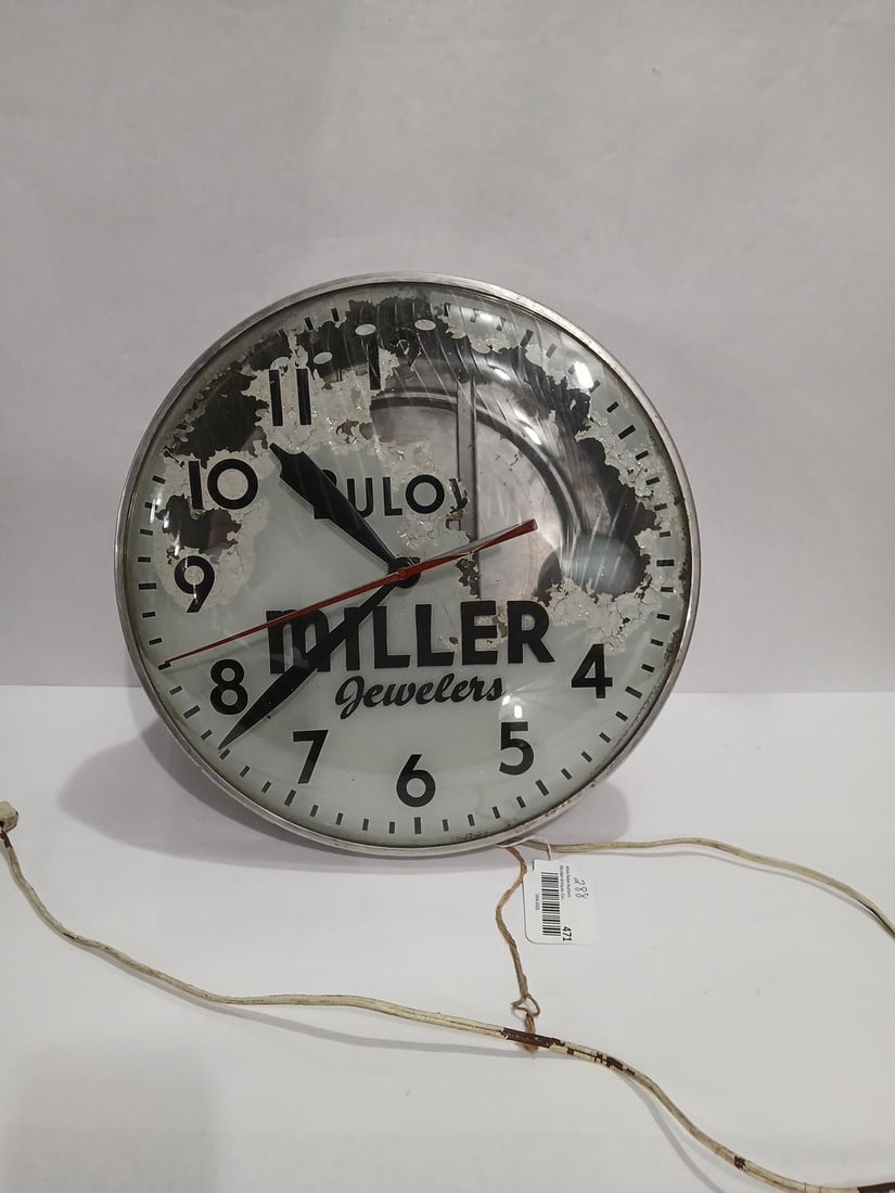 Bulova Miller Jewelers Clock: Paint is peeling from face but clock runs well. Light is not working but may need new bulbs. Glass face, 15 inches in diameter