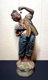 EARLY CHALKWARE CHERRY PICKER STATUE