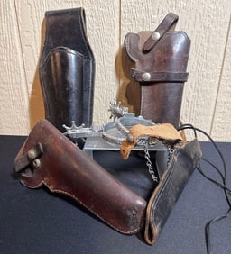 LEATHER HOLSTERS AND SPURS