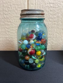 BLUE BALL JAR OF MARBLES AND SHOOTERS