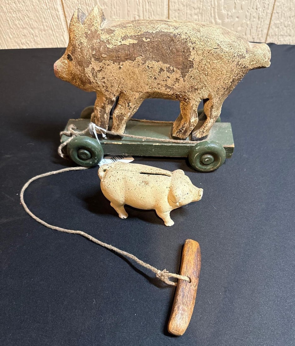 PRIMITIVE PIG PULL ALONG TOY & CAST IRON BANK: BANK IS 4X2. WOODEN PULL TOY IS 9X7