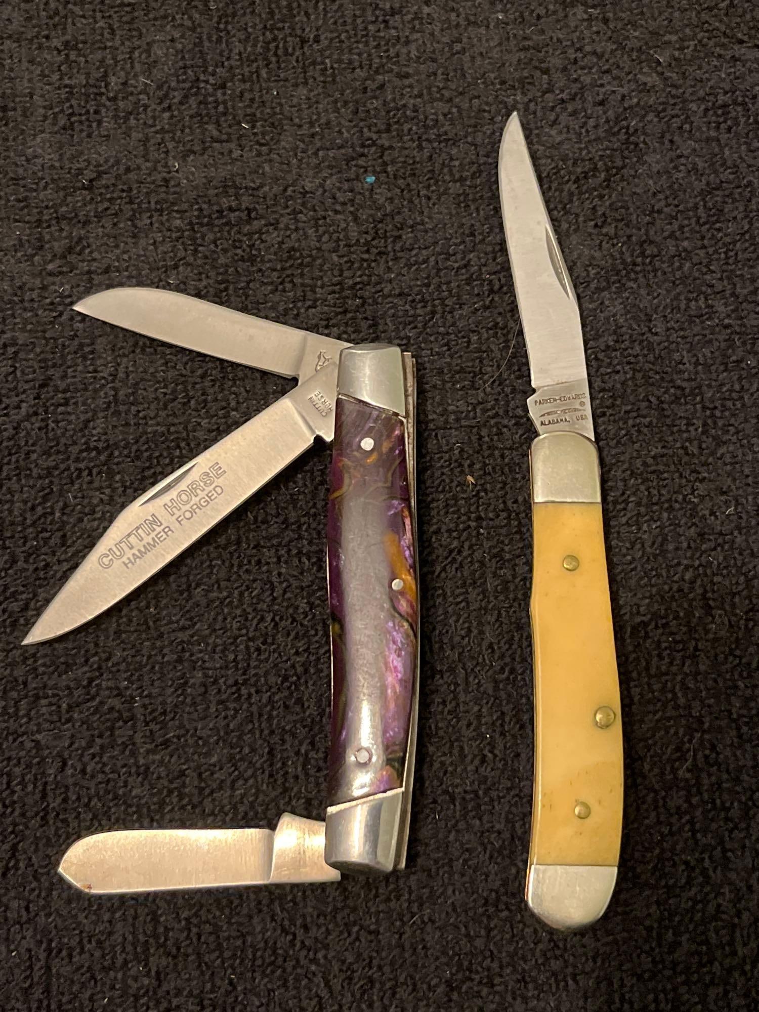 CUTTIN HORSE & PARKER POCKET KNIVES: CUTTIN HORSE HAMMER FORGED GERMAN MAKER. PURPLE SWIRL RESIN HANDLES. PARKER EDWARDS 1986. BOTH ARE OILED AND IN GOOD CONDITION.