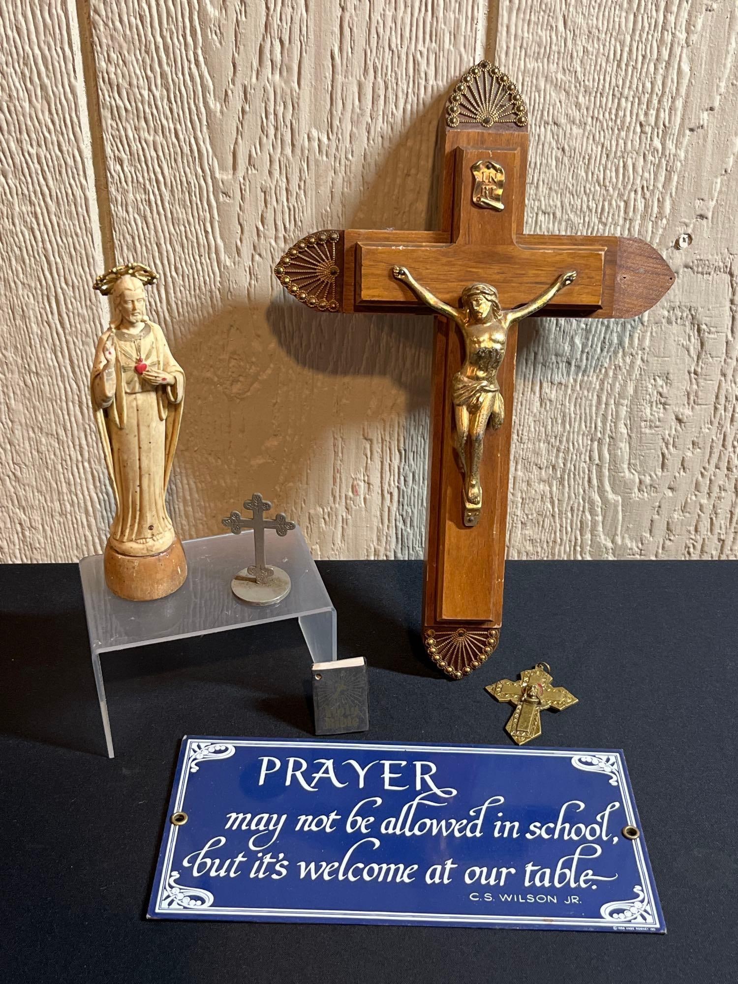 CRUCIFIX, PRAYER PORCELAIN SIGN, AND RELIGIOUS ITEMS: OAK HOLY WATER CROSS THAT OPENS TO REVEAL INNER STORAGE. JESUS, AND BRASS PENDANT. SIGN IS 9X4.5