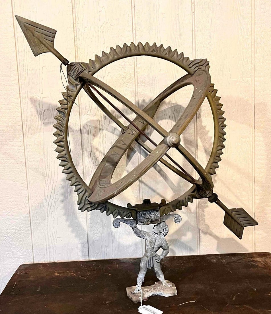 OUTSTANDING ASTROLOGICAL SYMBOL GLOBE SUNDIAL: STRONG MAN ON BOTTOM FEATURING, COUNT NONE BUT SUNNY HOURS AND THE HEAVEN SHOW HIS HANDY WORK. WITH DIRECTIONAL ARROW AND SYMBOLS AROUND GLOBE RING. 30X25X25