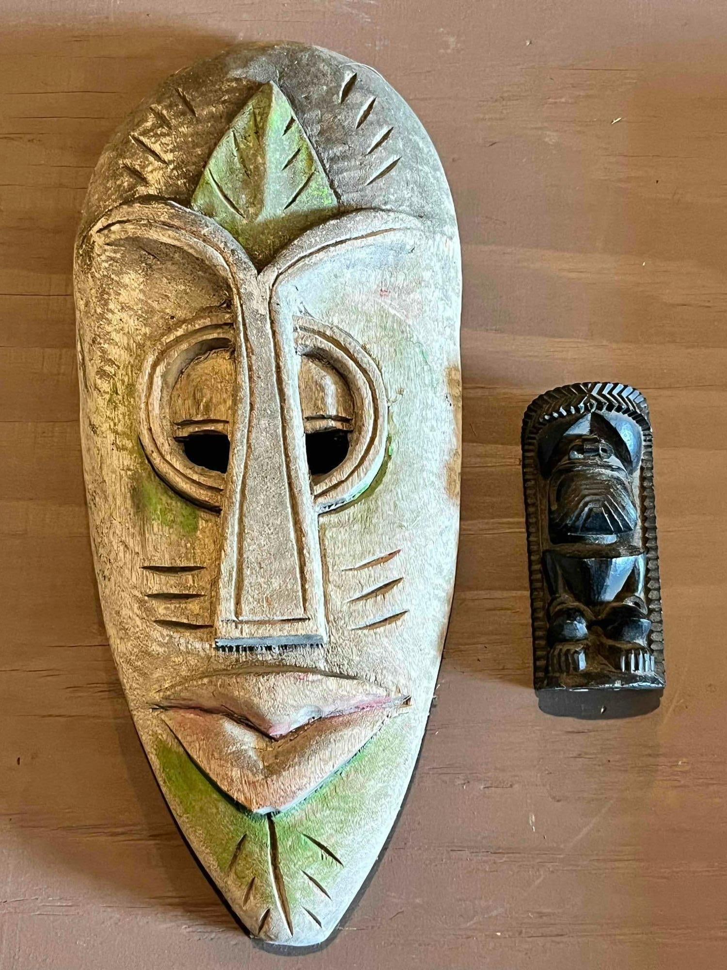 WOOD CARVED MASK AND LAVA MAN: SMALL FIGURE MARKED MADE IN HAWAII, WITH LAVA. BY COCO JOE. 4.5 INCHES. WOODEN MASH SIGNED ROGER FRANCOIS. 14 INCHES