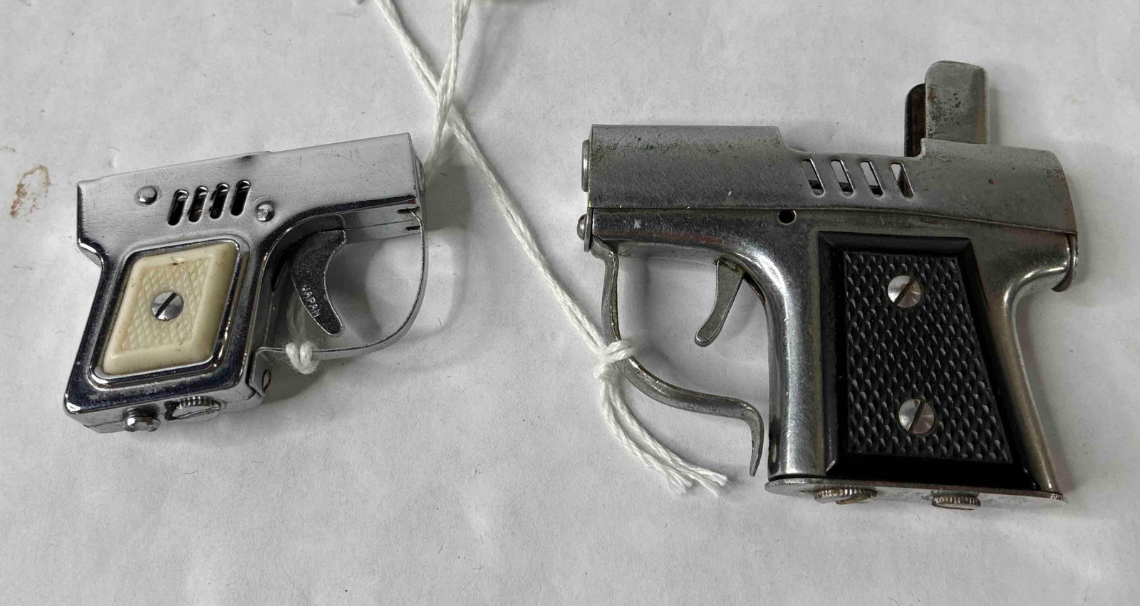 Mini Pistol Cigarette Lighters: Washington DC and Occupied Japan. Larger does have spark.