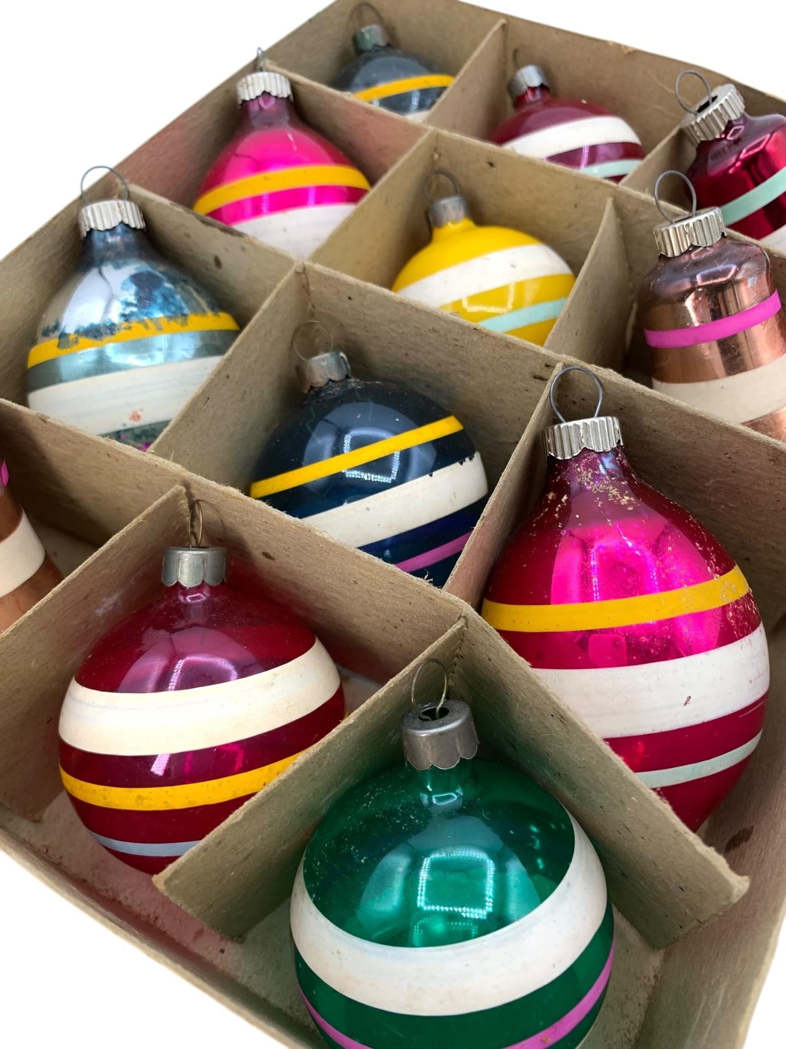 12 SHINY BRITE Vintage Striped Ball, Bell and Tapered Teardrop Glass Christmas Tree Ornaments in Box: Structurally sound with some color loss to the glass, light age and wear to the Shiny Brite box, Shiny Brite Made in U S of A embossed caps on most.