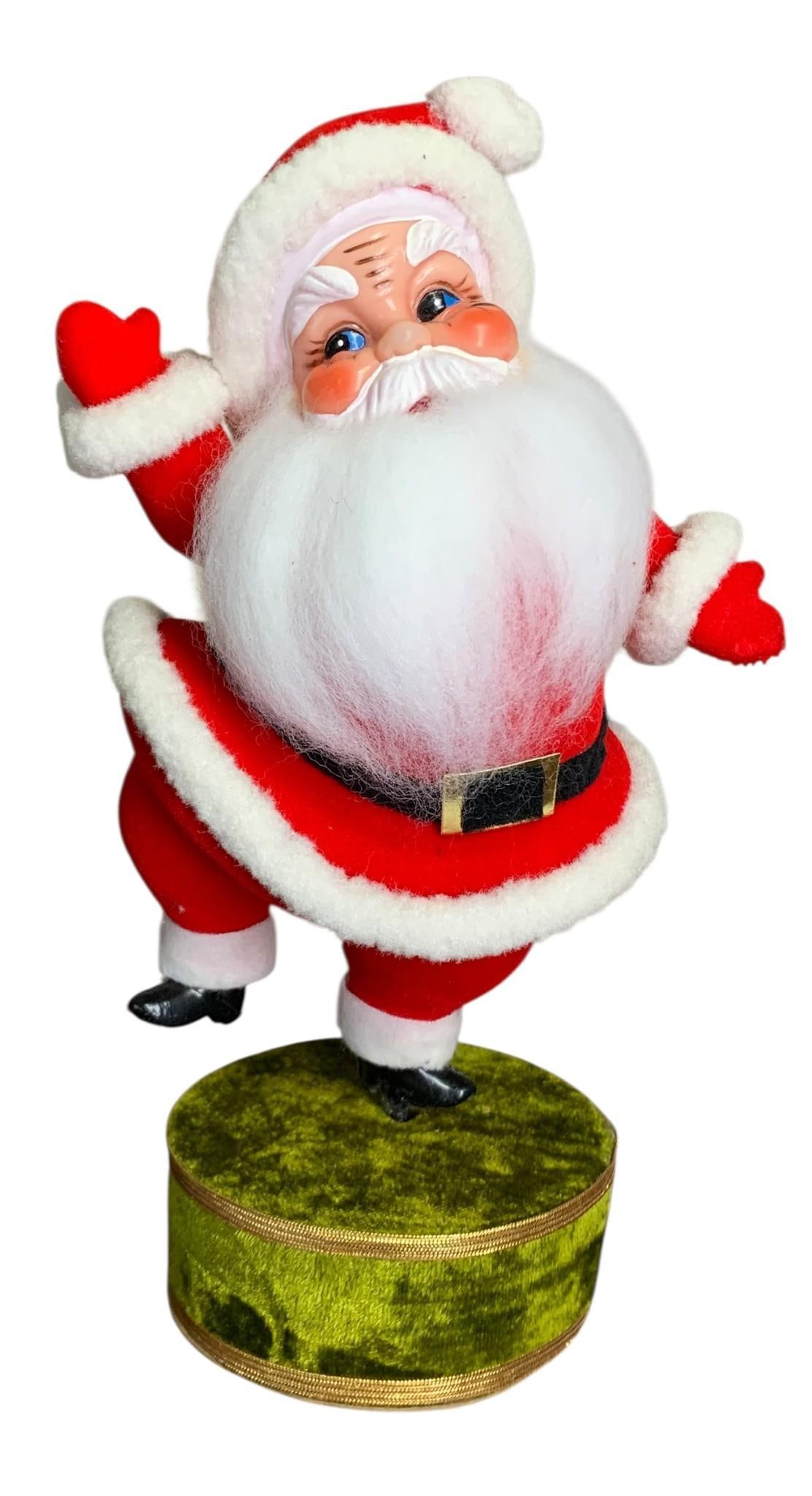 Mid Century JAPAN Musical Dancing Santa Revolving Christmas Holiday Decoration in the Box: Made in Japan label on the rear of the box and stamp on the base, cellophane window has damage with shelf wear to the paperboard and old tape, pine green velvet lined base, rotates and plays music whe