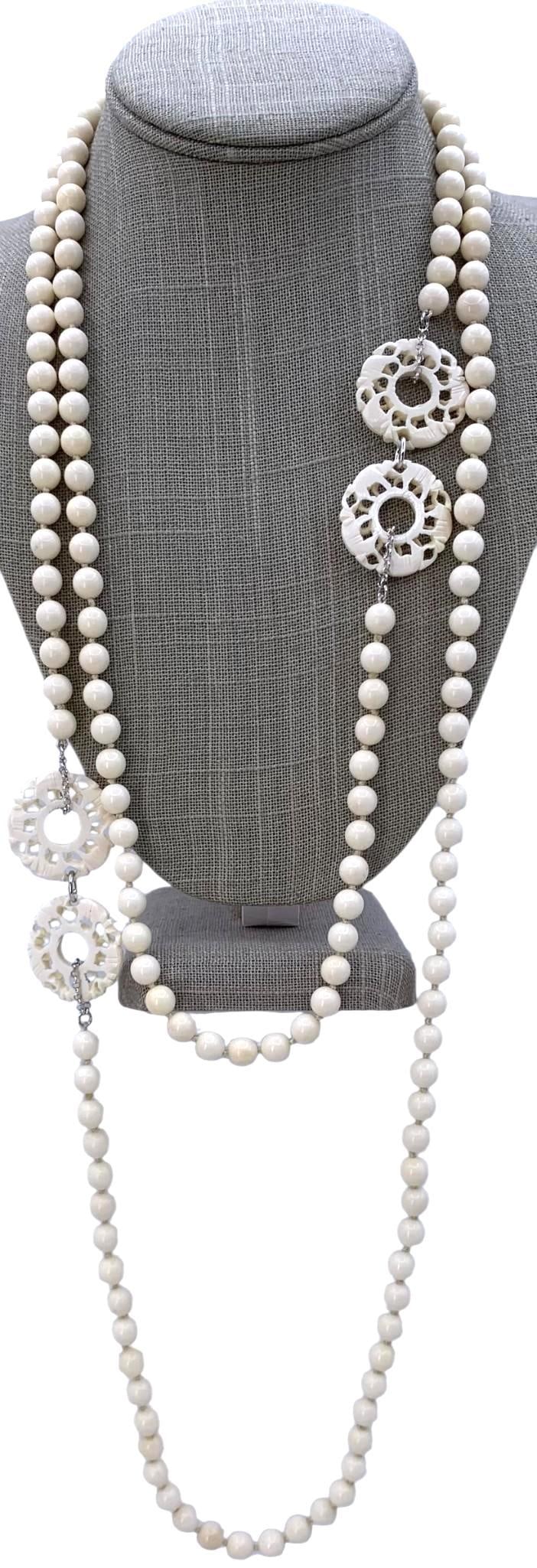Pair Hand Carved Natural Pierced Elephant Effigy Medallion Necklaces: Organic 5mm polished beads, hand knotted, pierced and carved openwork Elephant medallions, 28" to 38" circumference.