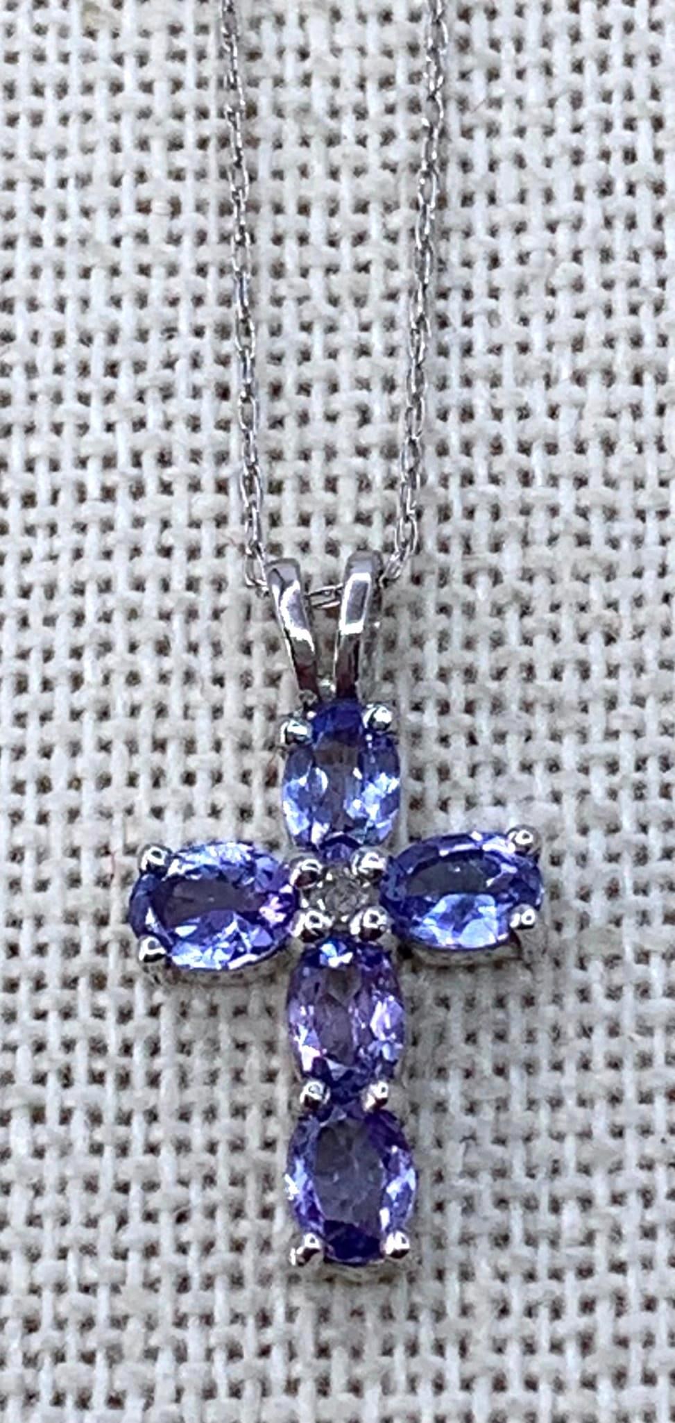 10k White Gold, Tanzanite and Sparkling CZ Cross Pendant on 10k Chain: 10k hallmark on the pendant and 18" chain, 1.4 gram weight.