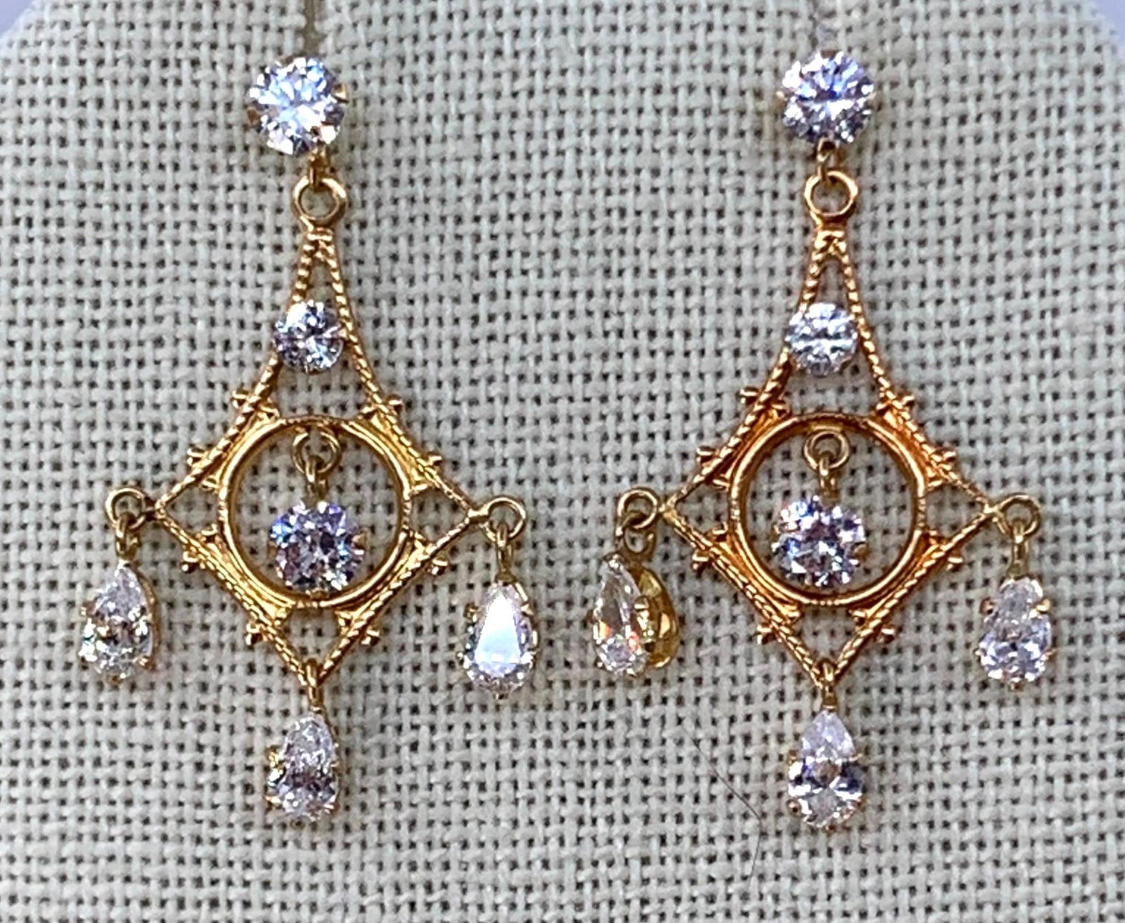 14k Yellow Gold and Glittering CZ Chandelier Earrings: Superb sparkle, hallmarked 14k CZ, 2.4 gram weight combined, 1 1/4" length with openwork filigree detail.