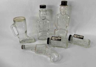 Glass Candy Trucks, Glass Boot, Gun and Lincoln Bank Bottles all w/ Lids and Caps