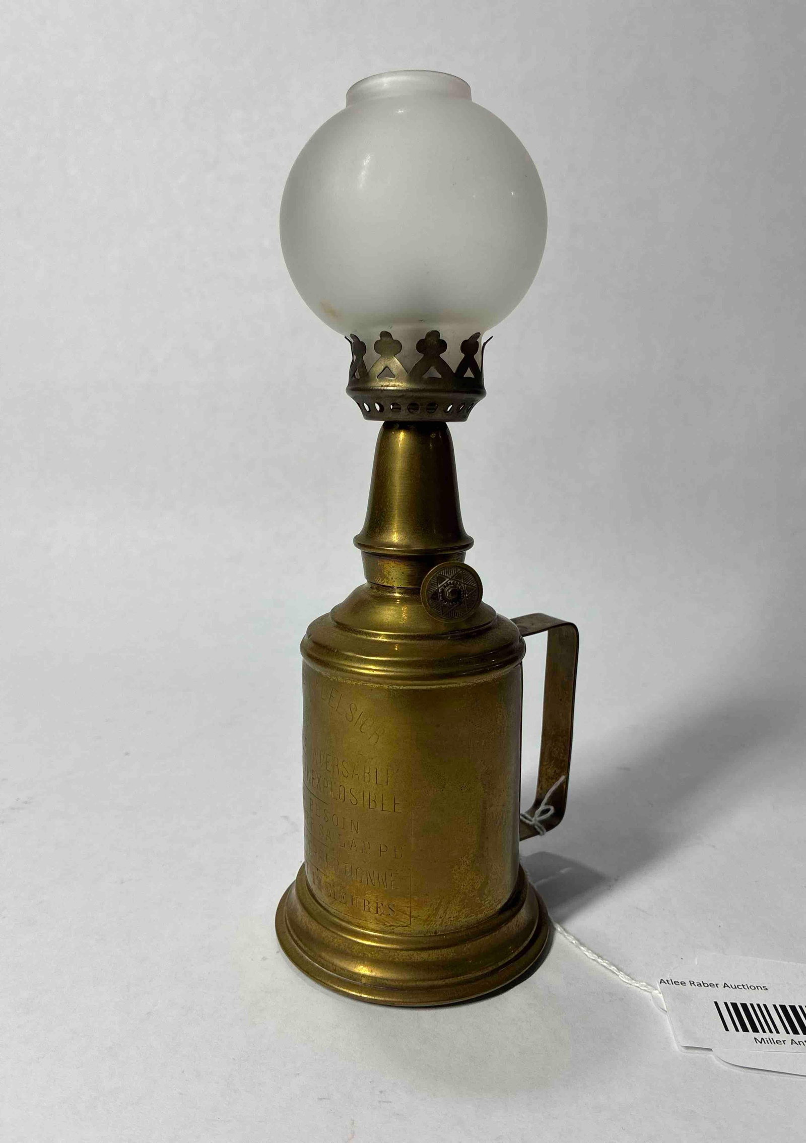 Lampe Excelsior Brass Finger Lamp: Stamp to front of brass oil holder. Includes glass globe and wicking. 9 inches tall