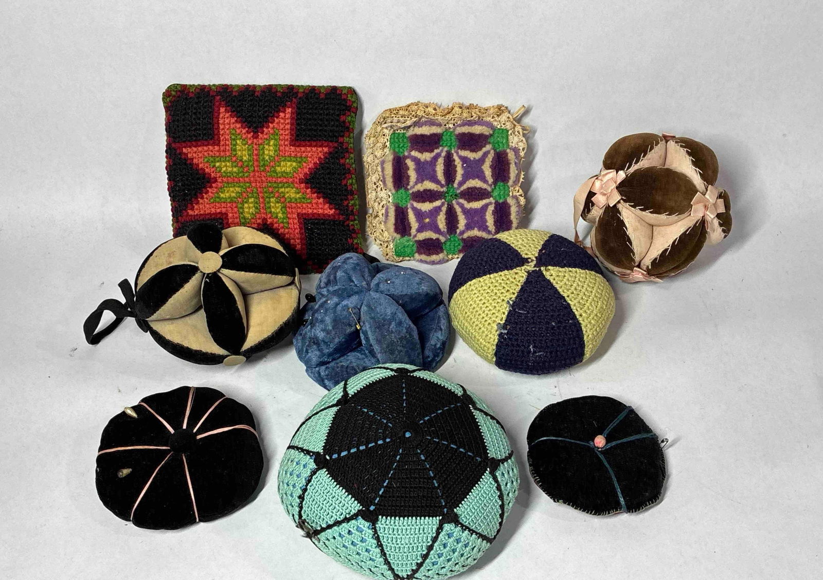 Early PA Fabric Pin Cushions: Several Pennsylvania Amish pin vision balls as well as hand made and knitted pieces.
