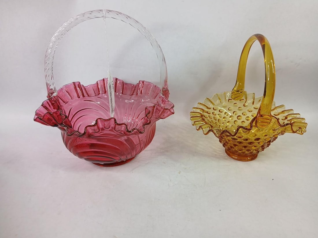 Art Glass Cranberry & Carmel Baskets: Hobnail and arch swirl. Both are in good condition. 7 and 9 inches tall.