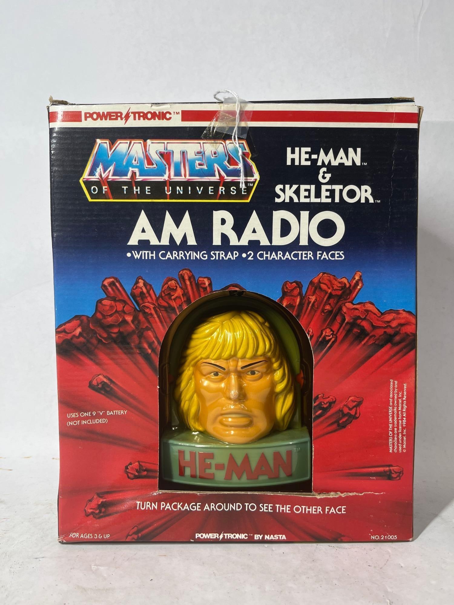 Masters of The Universe He Man AM Radio w/ Carrying Strap and 2 Character Faces NOS: This NOS vintage Power Tronic Radio would make a great addition to any vintage toy collection 