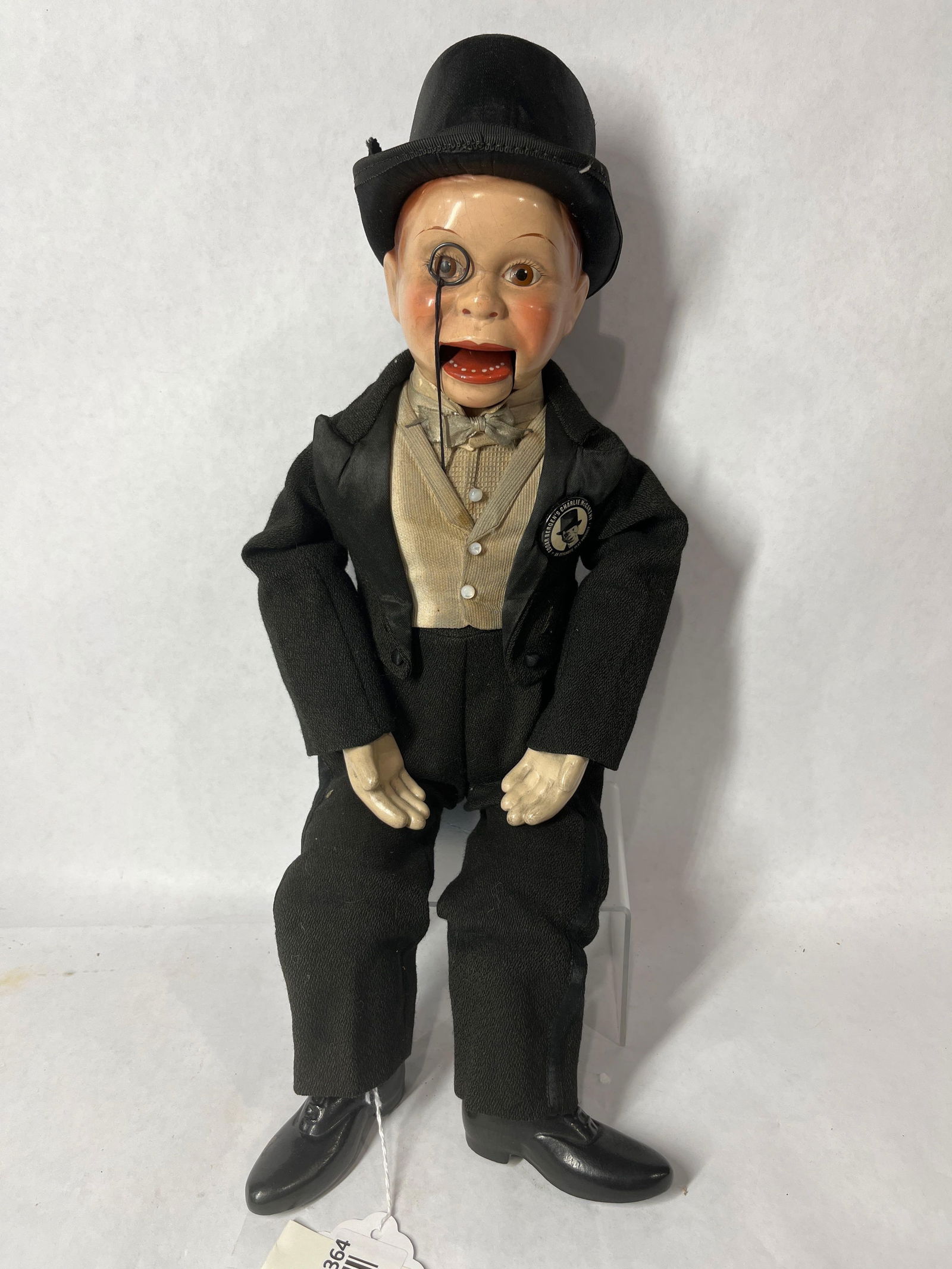 Effanbee Charlie McCarthy Ventriloquist Doll: Hand painted wooden head, hands, and feet. With original outfit and button. 17 inches tall. Great condition with some soiling showing to shirt