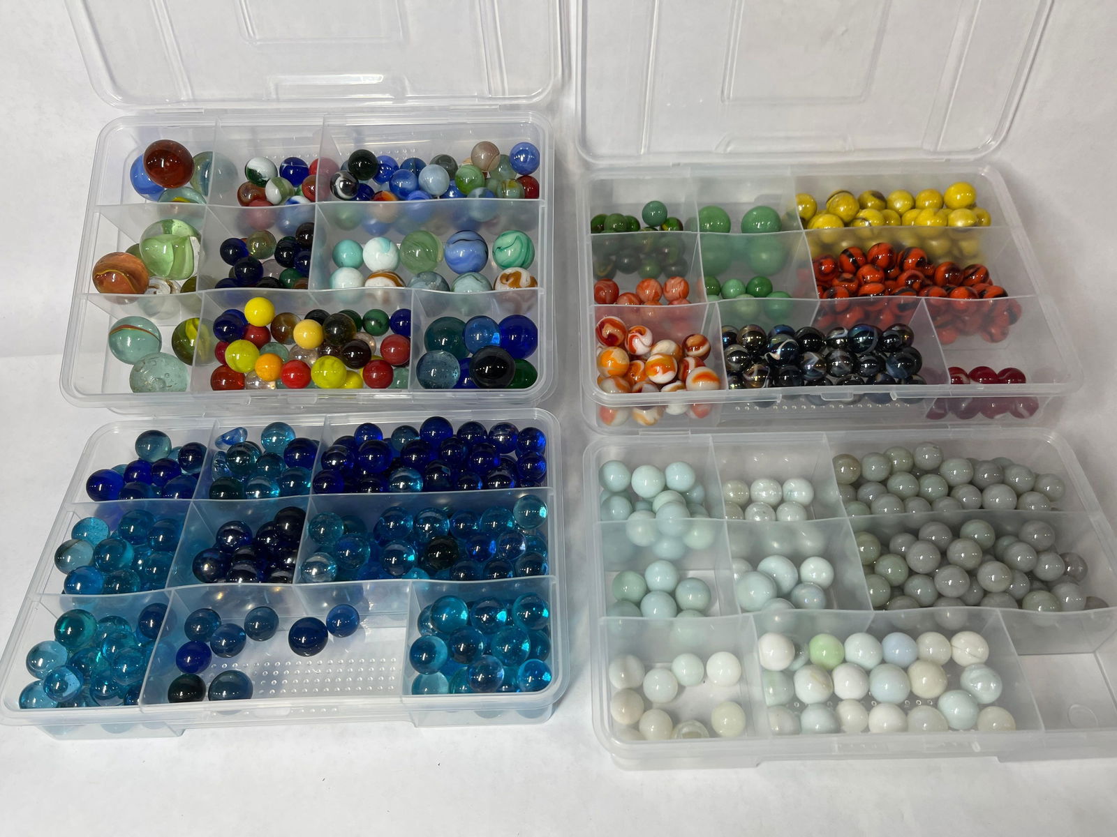 Shooters and Glass Marbles: Many uranium glass marbles. 4 full cases