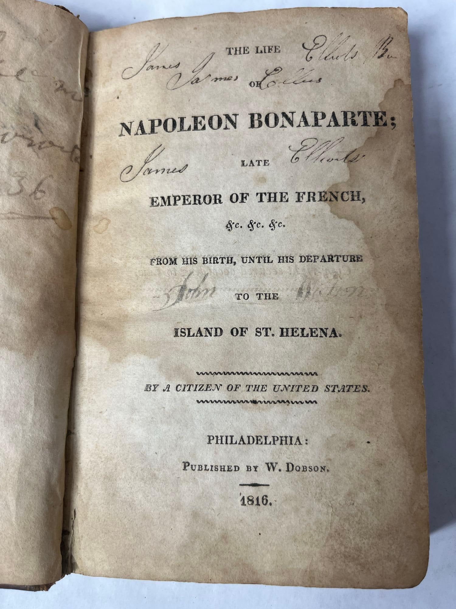 Leather Bound 1816 Napoleon Bonaparte Biography: Early script writing shows to inside cover. Pages are in good condition with a small hint of water damage
