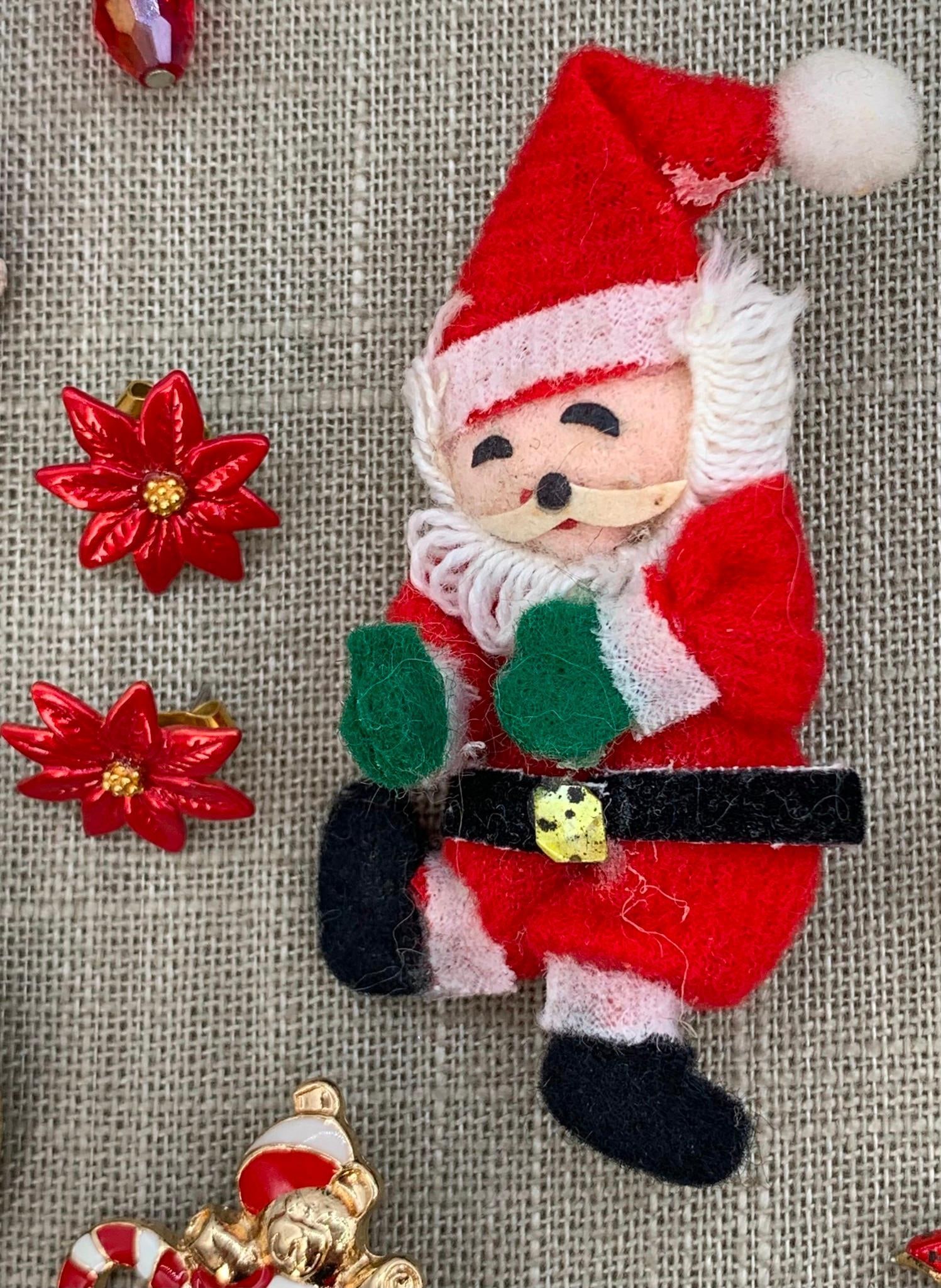 28 pc Vintage Christmas Holiday Costume Jewelry Collection: Kirks Folly charm bracelet, Shiny Brite Radko brooch/earring set in the box, pierced and hook earrings, early Santa brooch with added pinback, holly and jingle necklaces, Santa locket and more!