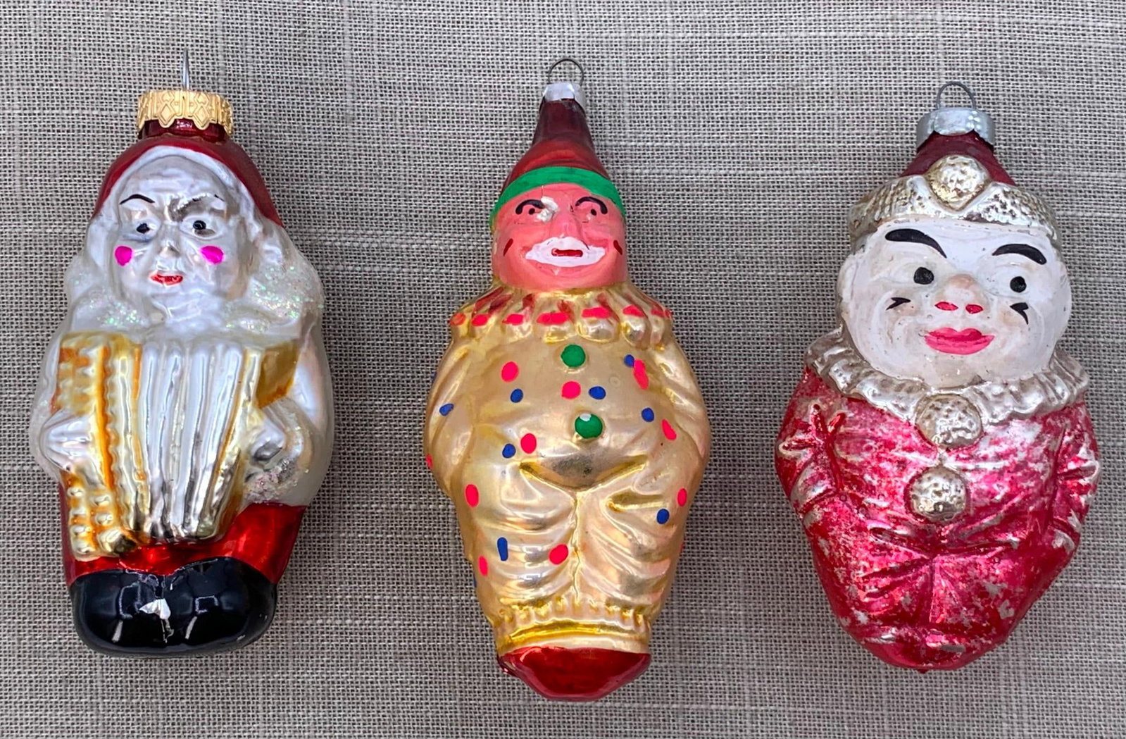 3 Antique to Vintage German Maniacal Clown Mercury Glass Christmas Tree Ornaments: 4 3/4" to 4 1/2" length, structurally sound with areas of color loss.