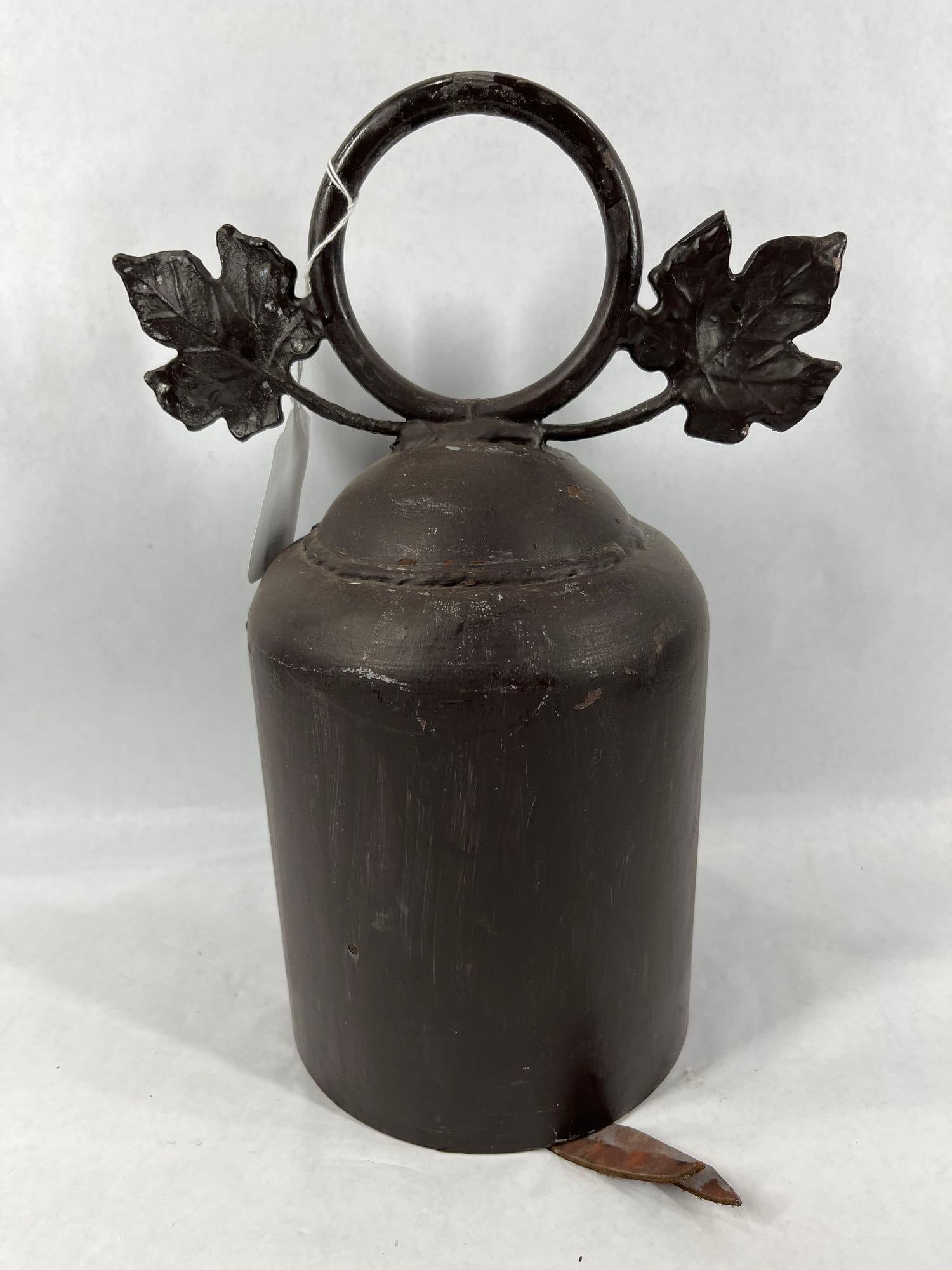 Heavy Moroccan DInner Bell: Leaf and ring top with a soft rubber dinger. 14 inches tall.