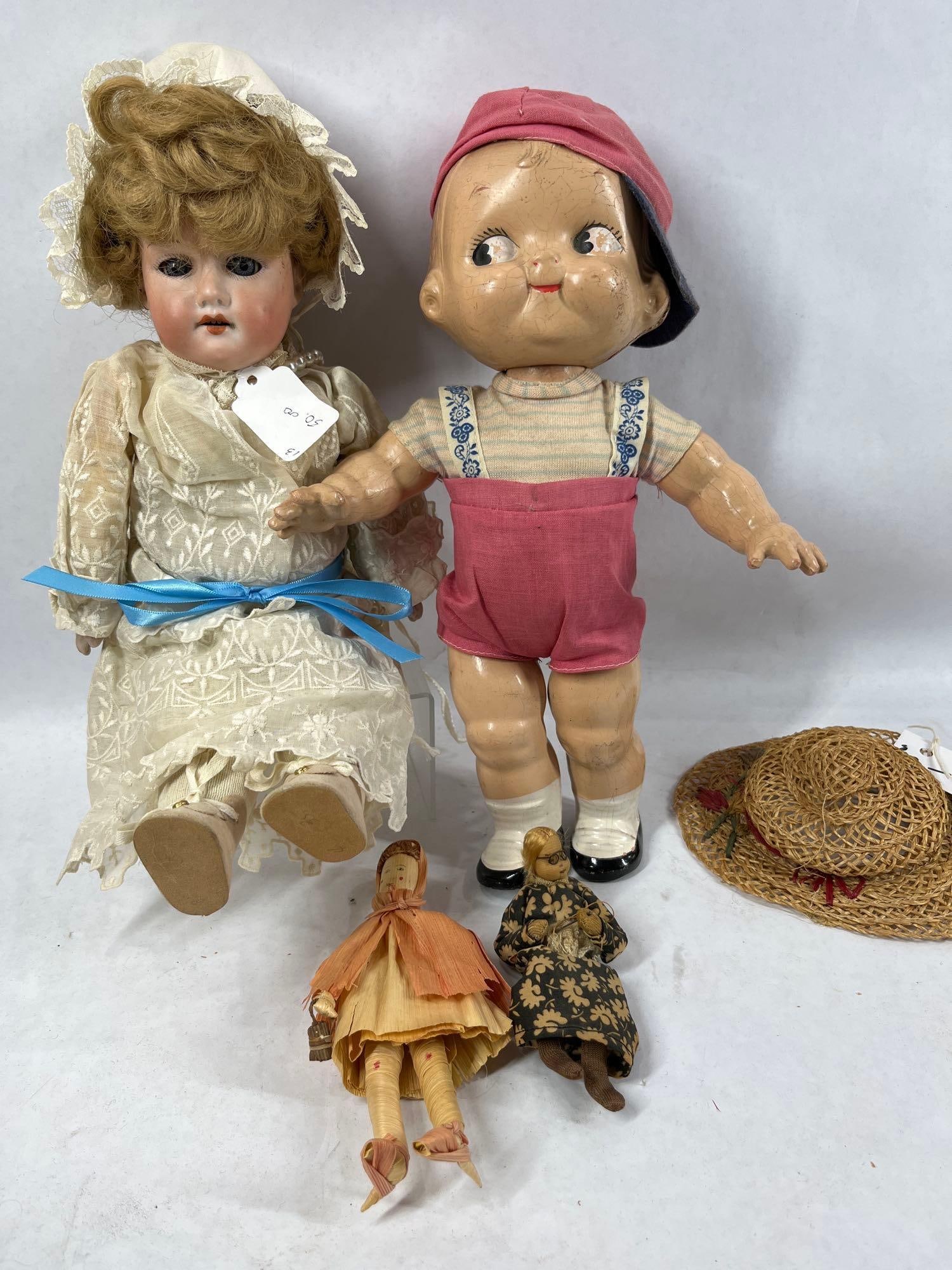 Armand Marseille, Kewpie, and Doll Parts: AM doll has a bisque head, marked on neck, with sleepy eyes. 13 inches tall. Other dolls are cloth. Kewpie has a head in need of repair.