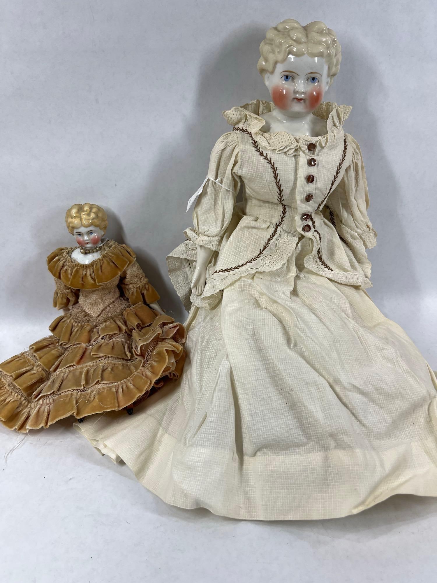 China Head Dolls: Both with cloth bodies and china limbs and heads. 12.5 and 20 inches tall