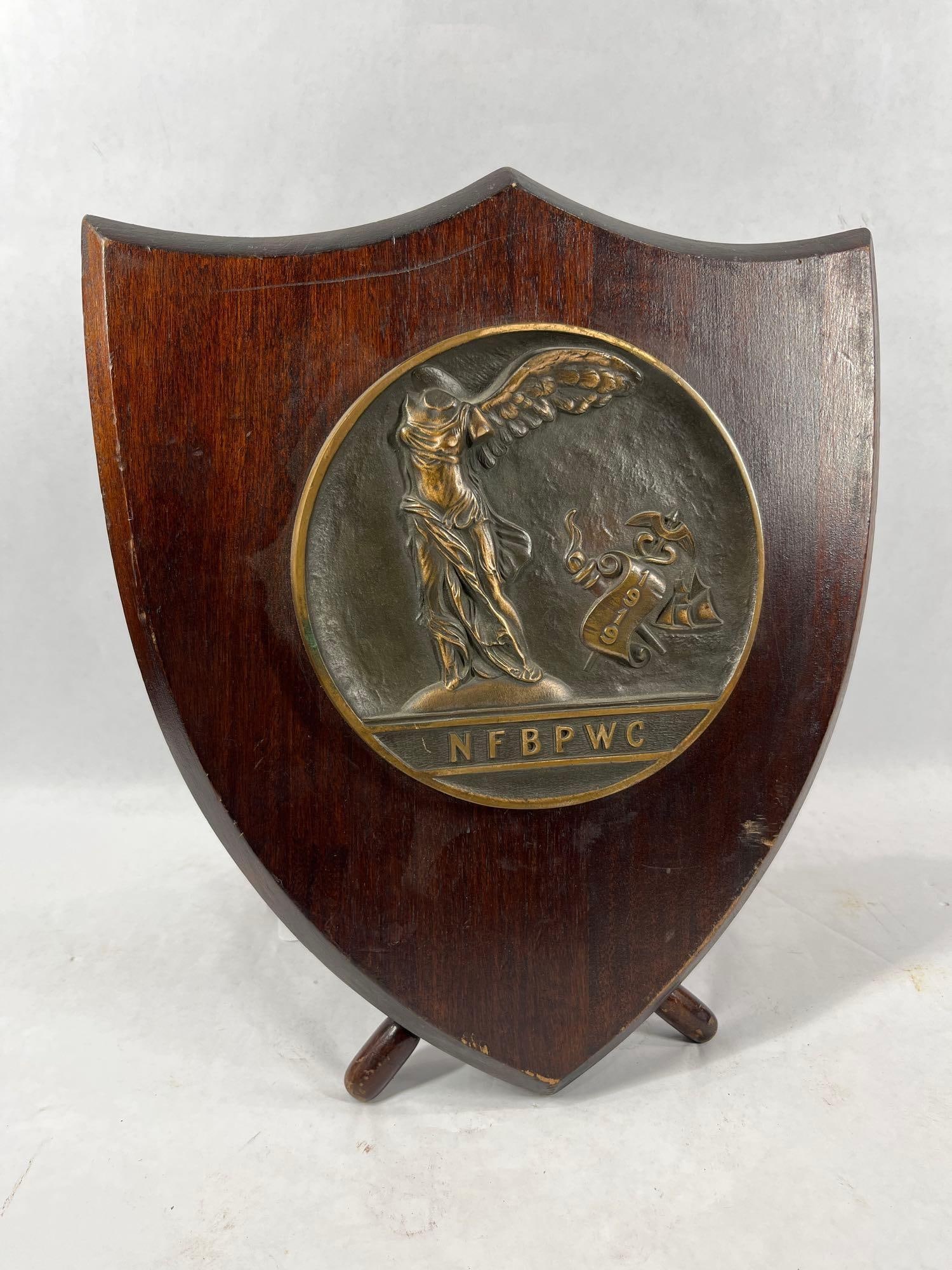 1919 Federation of Business and Professional Women's Club: Wooden plaque with brass medallion, on self standing frame. 14x12