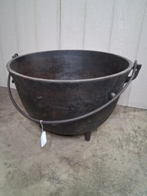 Large cast iron footed kettle