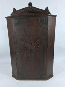 Small Early carved hanging corner cabinet