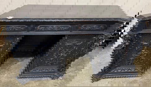 Highly Carved Antique Knee Hole Desk w/standing figural corners