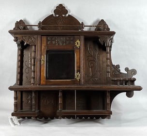 Unusual early carved hanging cabinet