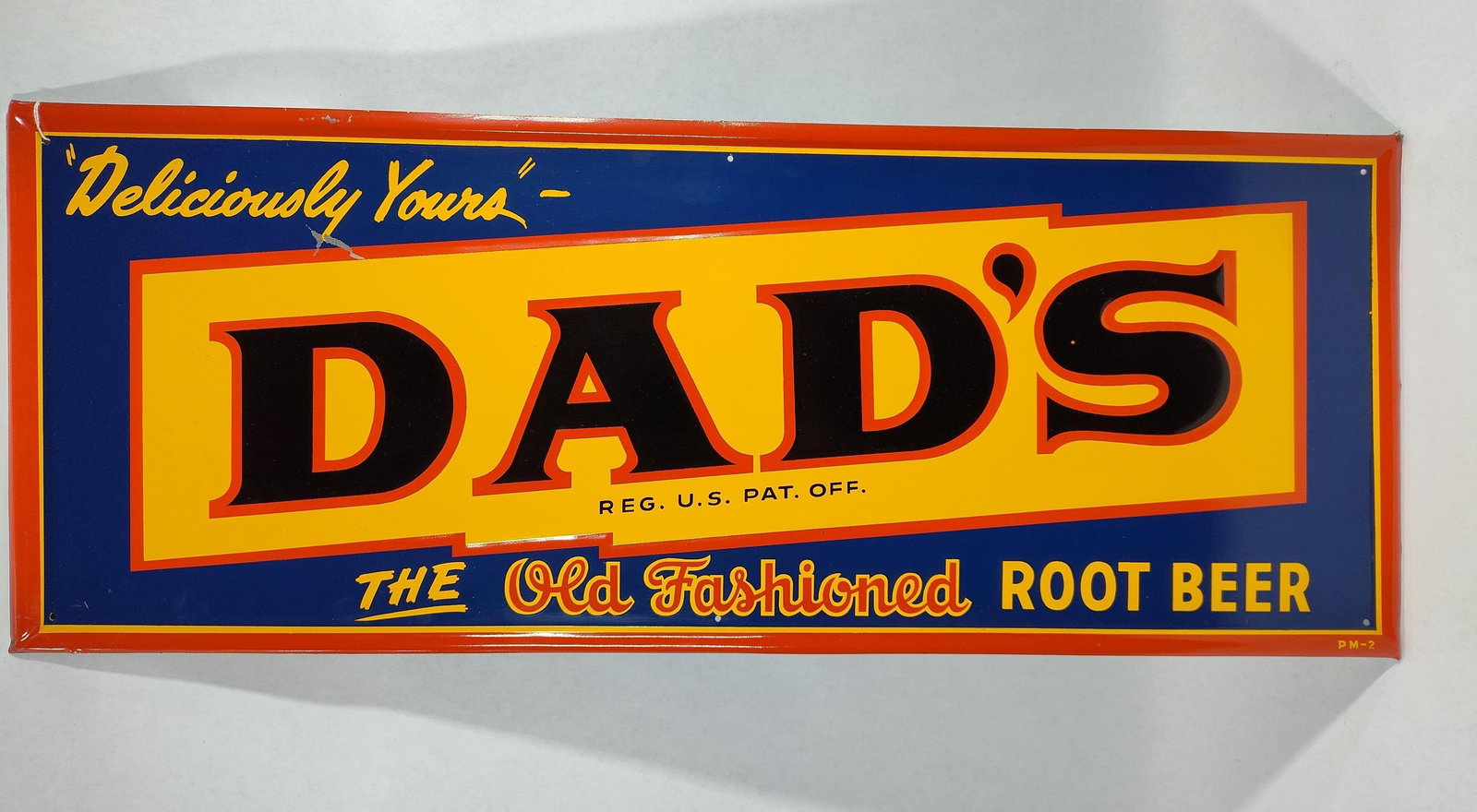 SST Dad's Root Beer self-framed sign: 1-sided painted tin self-framed and embossed sign with 1 scratch above D, otherwise in excellent condition!! 12in X 31in.