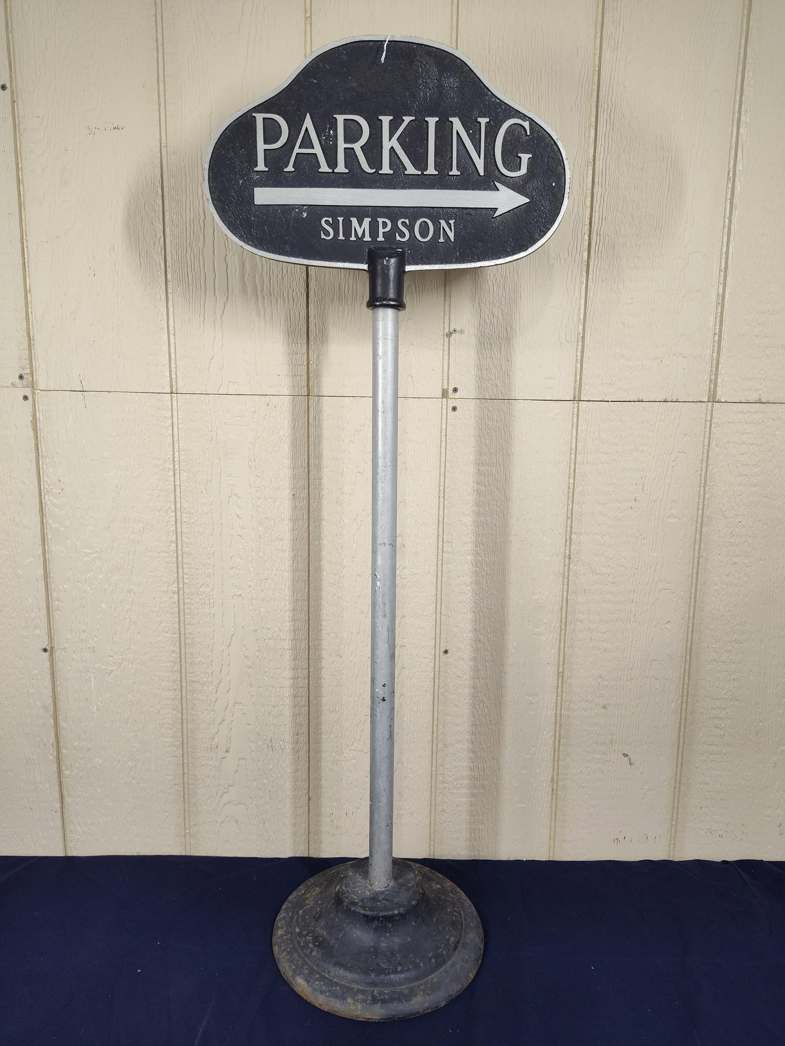 Simpson Parking curb sign: 2-sided cast aluminum sign on original base. 17.5in wide 47in tall.
