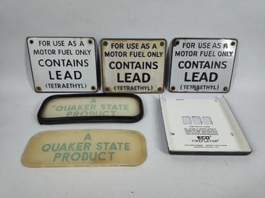 Lot of pump signs and glass ad panels