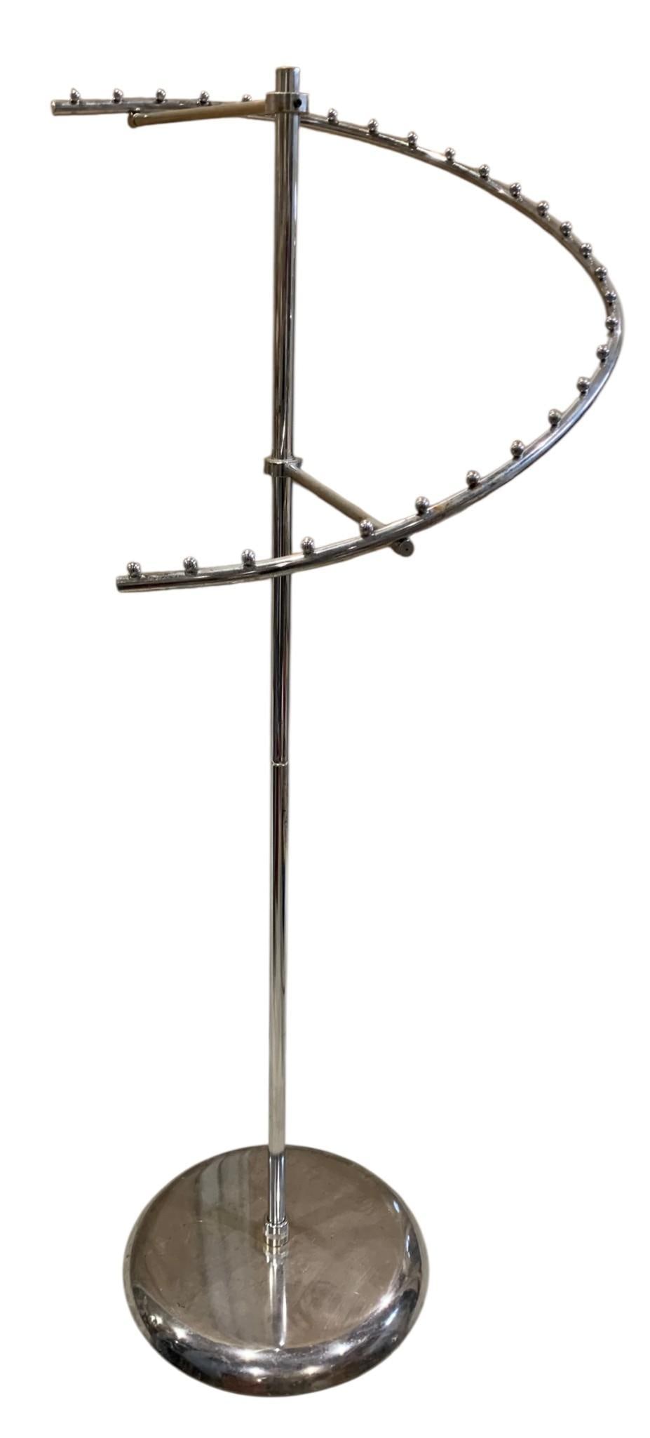 Mid Century Chrome 2 pc Spiral Department Store Clothing Display Rack: 62" tall x 21", 17" across the weighted base, separates into two pieces as shown, clothing shown is Not included and offered in separate lots. 