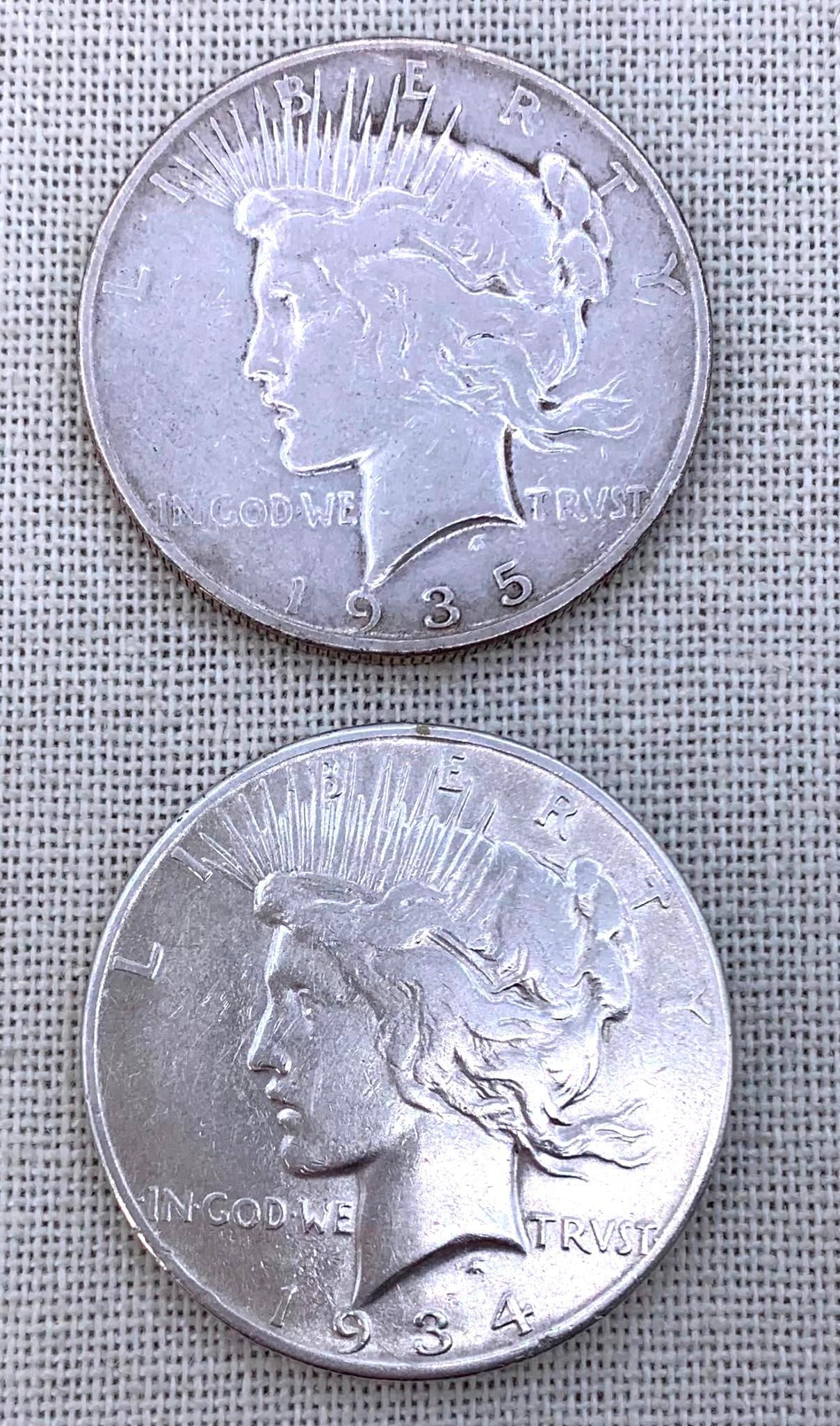 Two 1934 S & 1935 S Silver Peace Dollar Coins: Circulated, clean coins.