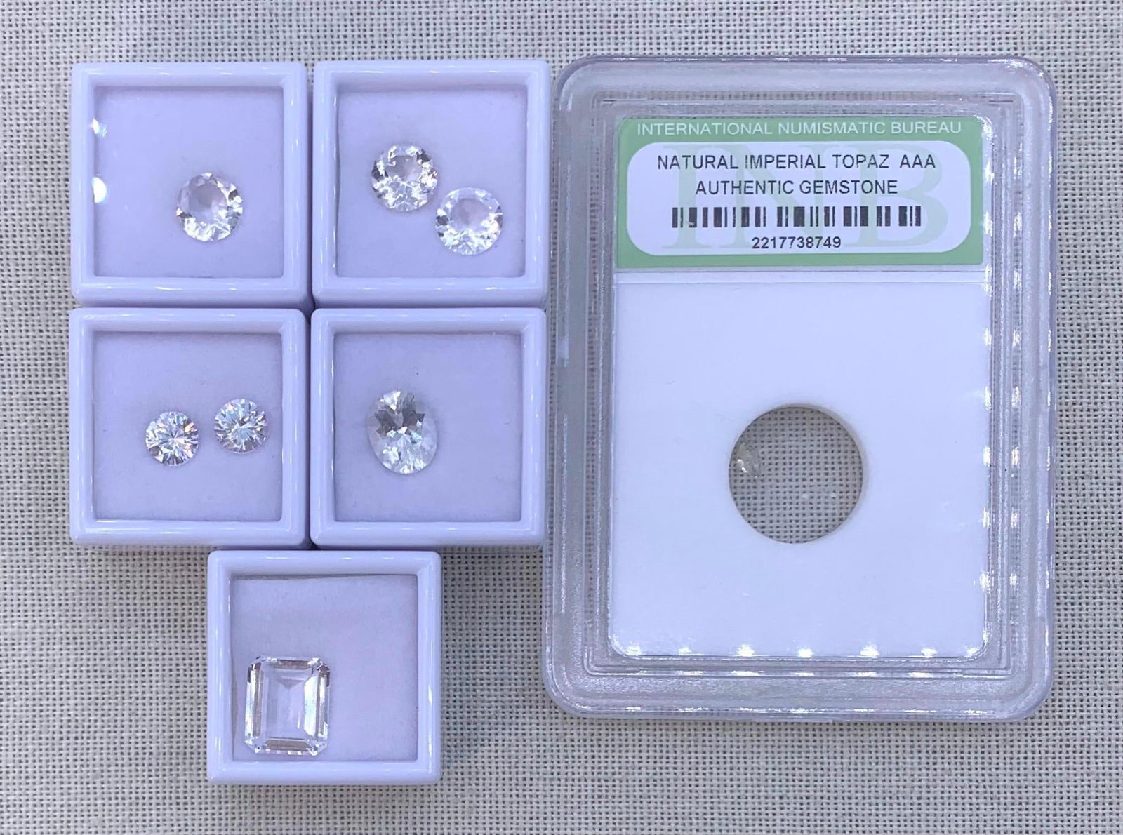 8 pc Large 12mm to Petite Carat Unmounted Jewelers TOPAZ Gemstones: International Numismatic Bureau Natural Imperial Topaz AAA graded marquise shape gem in the case, Incredible 12x10mm emerald cut Topaz, Three 8mm round cut, radiant 10x8mm oval and a pair of 6.5mm (Cr