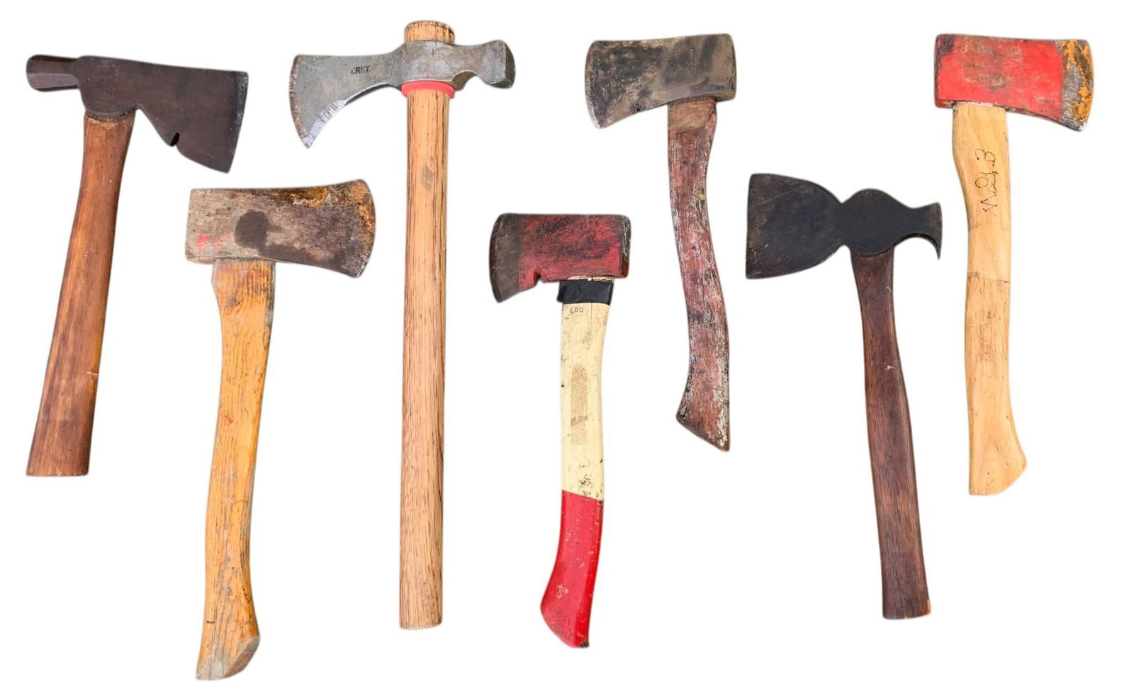 7 pc Antique to Vintage Huntsman, Rescue, Homesteading Axe & Hatchet Collection: Winchester & Plumb makers, old to vintage, each with some age and wear to the materials.