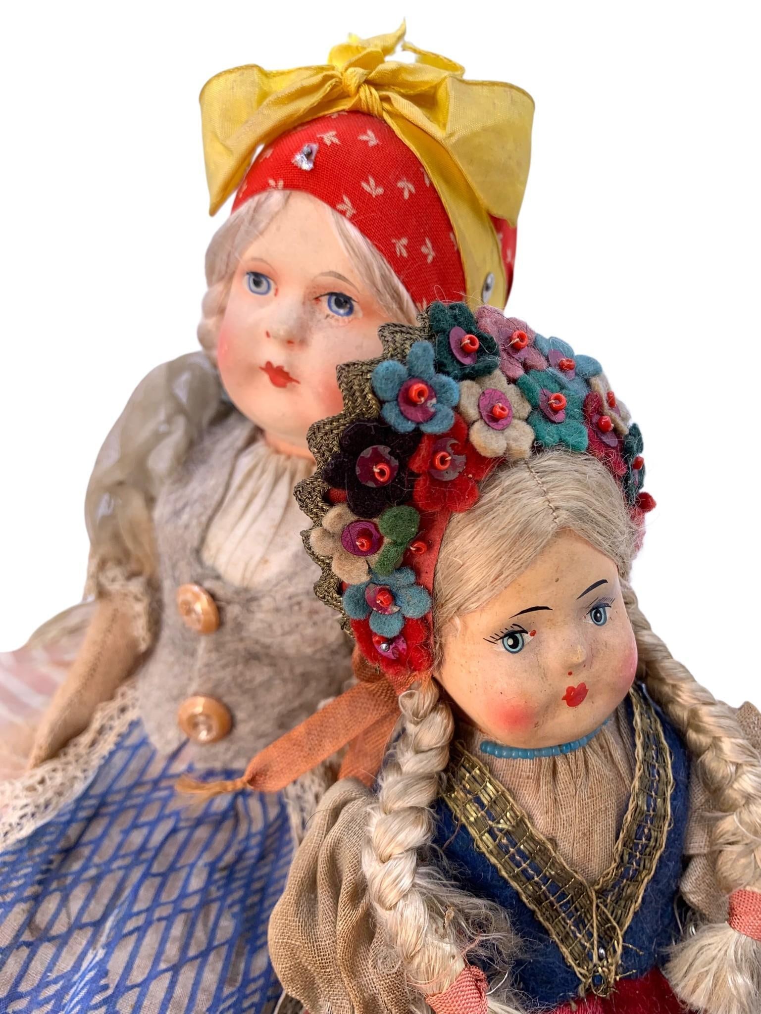 2 Antique European Jointed Arms & Legs Cloth Body Folk Art Dolls: 1) 12" length, metal pinned jointed arms and legs, hand painted face, hand and machine stitches, woolen vest, glass button detail, gelatin sequin accents, stuffed cloth body2) 9" length, Made