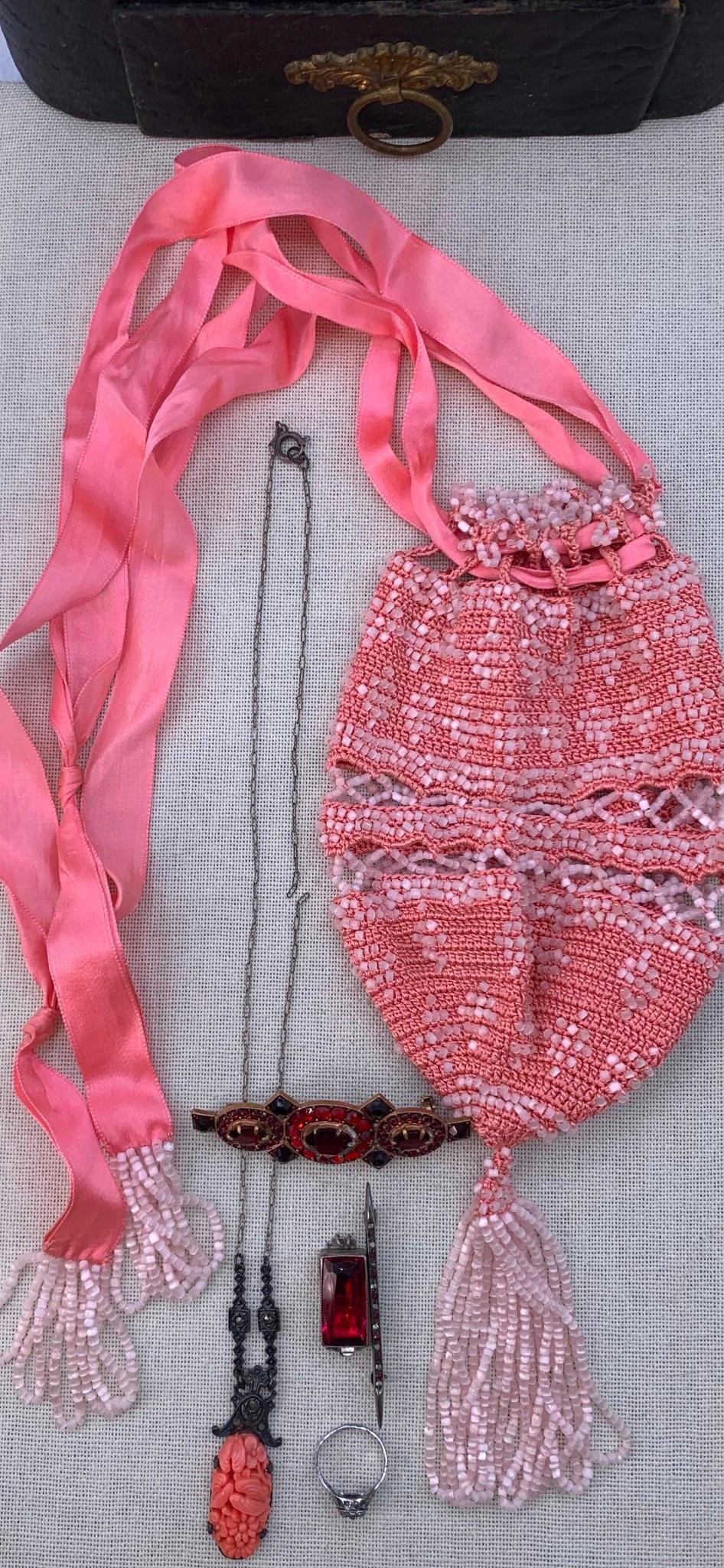Antique Collar Box, 1920s Flapper Salmon Pink Beaded Reticule, Sterling Silver & Costume Jewelry: 1) Antique faux hide covered paperboard collar box with drawer and embossed hardware, age to the lining with some missing silk, 7" x 6 3/4" x 7"2) 1920s salmon pink crochet reticule, silk