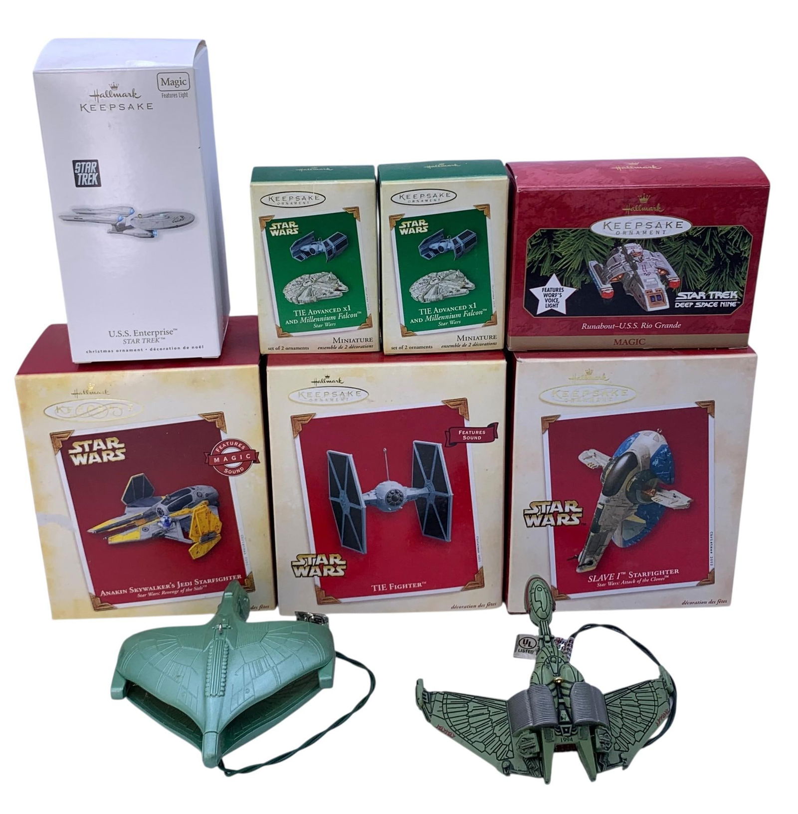 9 pc Star Wars & Star Trek Sci Fi Intergalactic Hallmark Christmas Tree Ornaments: Some with Sound or Lights, 2 without a box, minor shelf wear to the paperboard, the miniature Tie Advanced x1 and Millennium Falcon are a 2 pc set (2 pc per box).