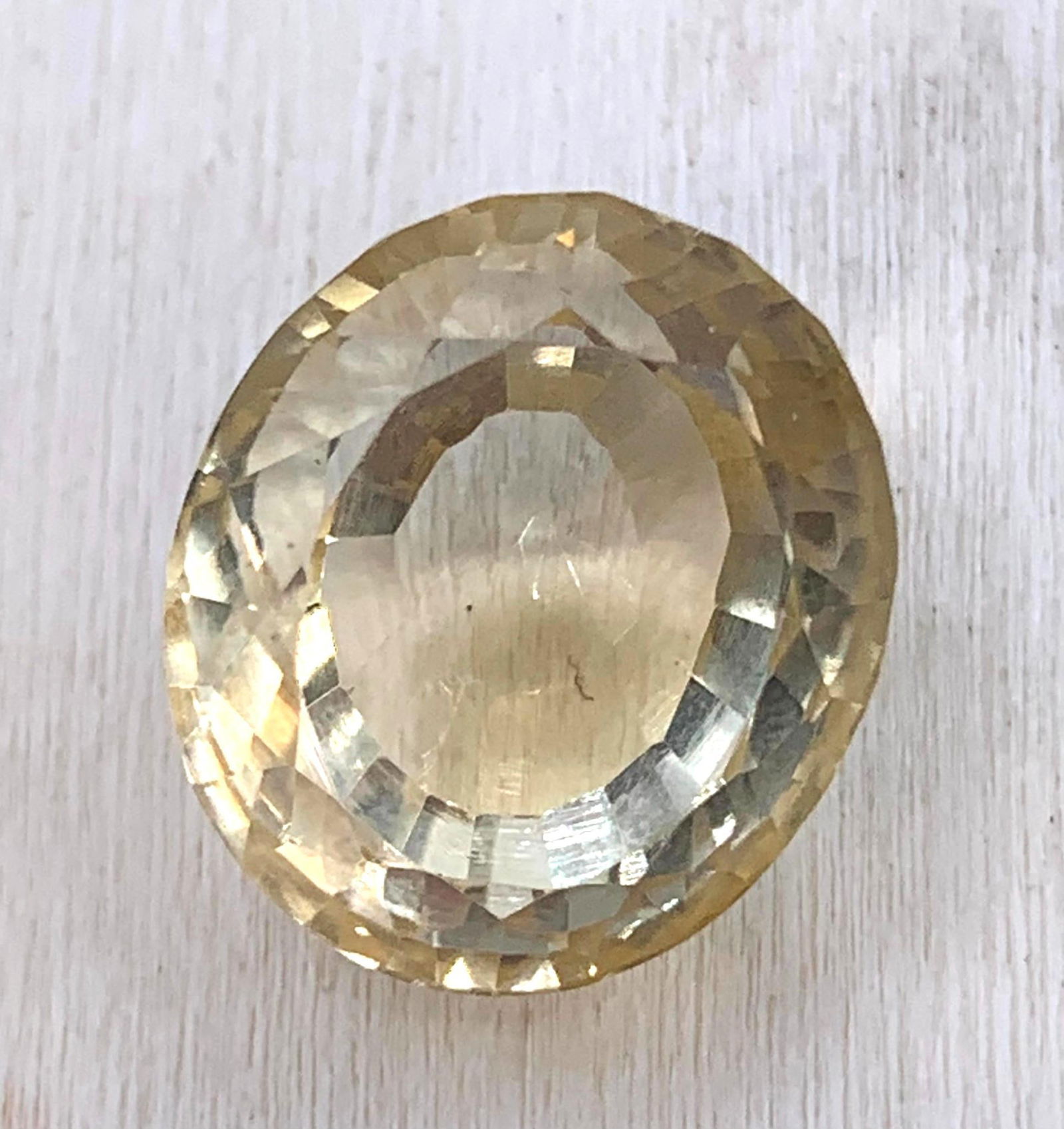 25.01 Carat Natural Yellow Citrine Unmounted Jewelers Gemstone with Appraisal: 2022 appraisal included, 17.69mm x 15.5mm x 13.19mm, oval mixed cut Citrine gem in a soft daffodil yellow hue, LOVELY! 